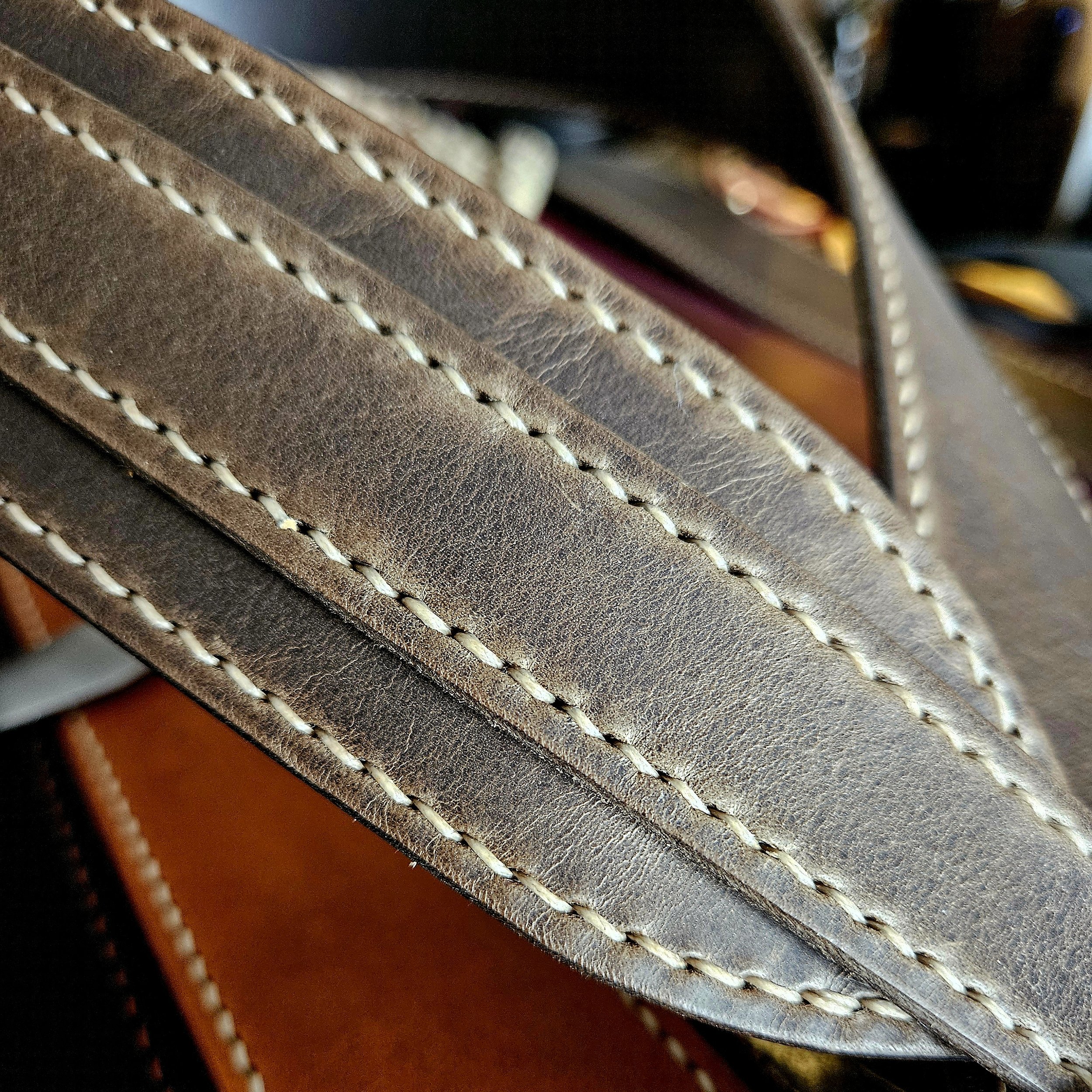 Hand made leather guitar strap. Hand stitched. Solid brass buckle. Made in UK.