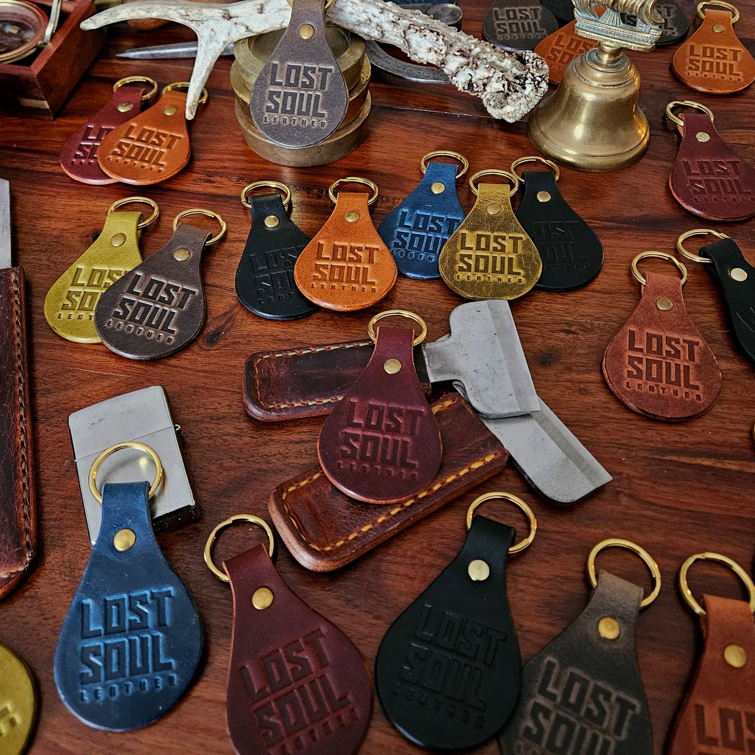 Banded key fobs and merchandise. Vegetable tanned leather. Stamped. Solid brass fittings. One of a kind. Merchandise.