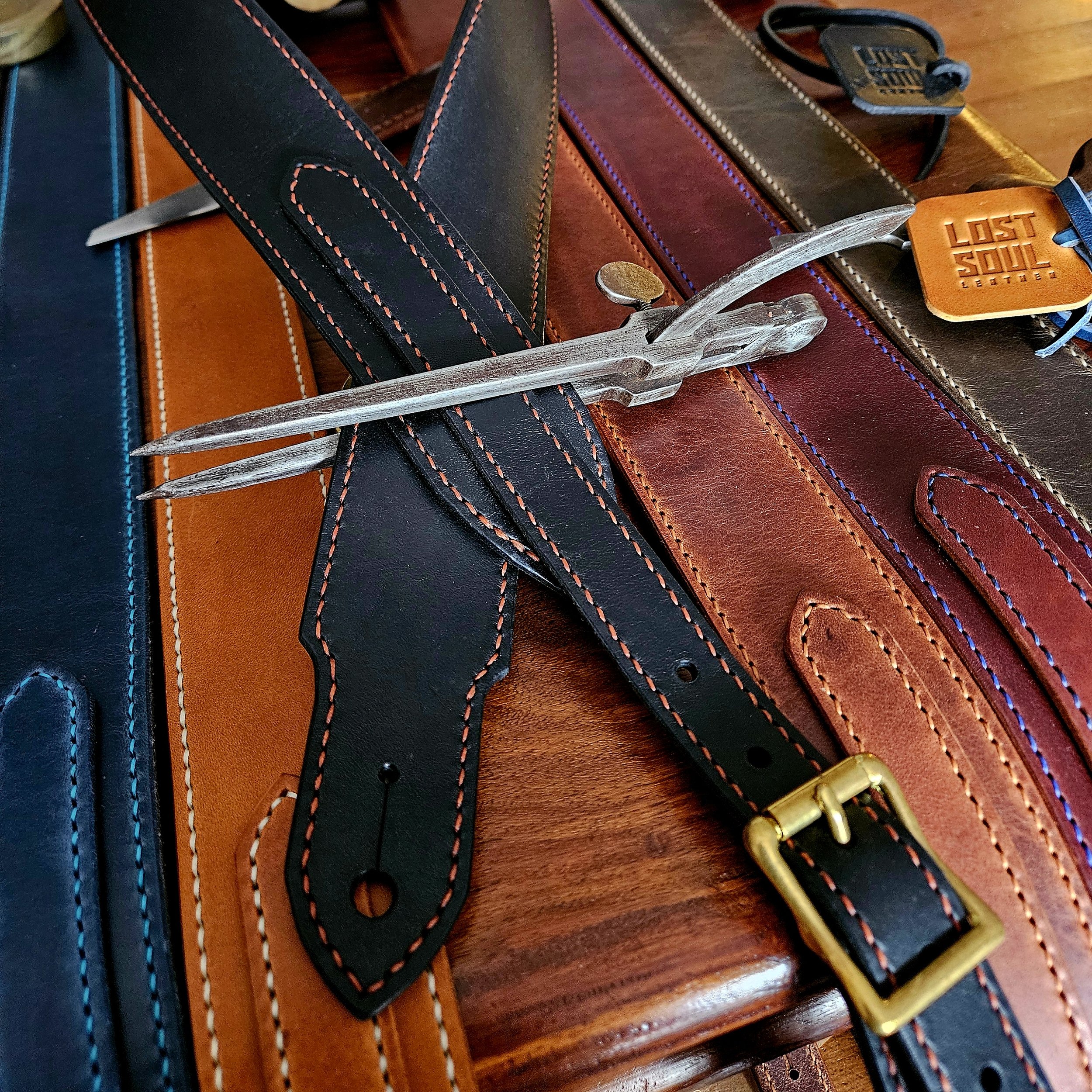 Hand made leather guitar strap. Hand stitched. Solid brass buckle. Made in UK.