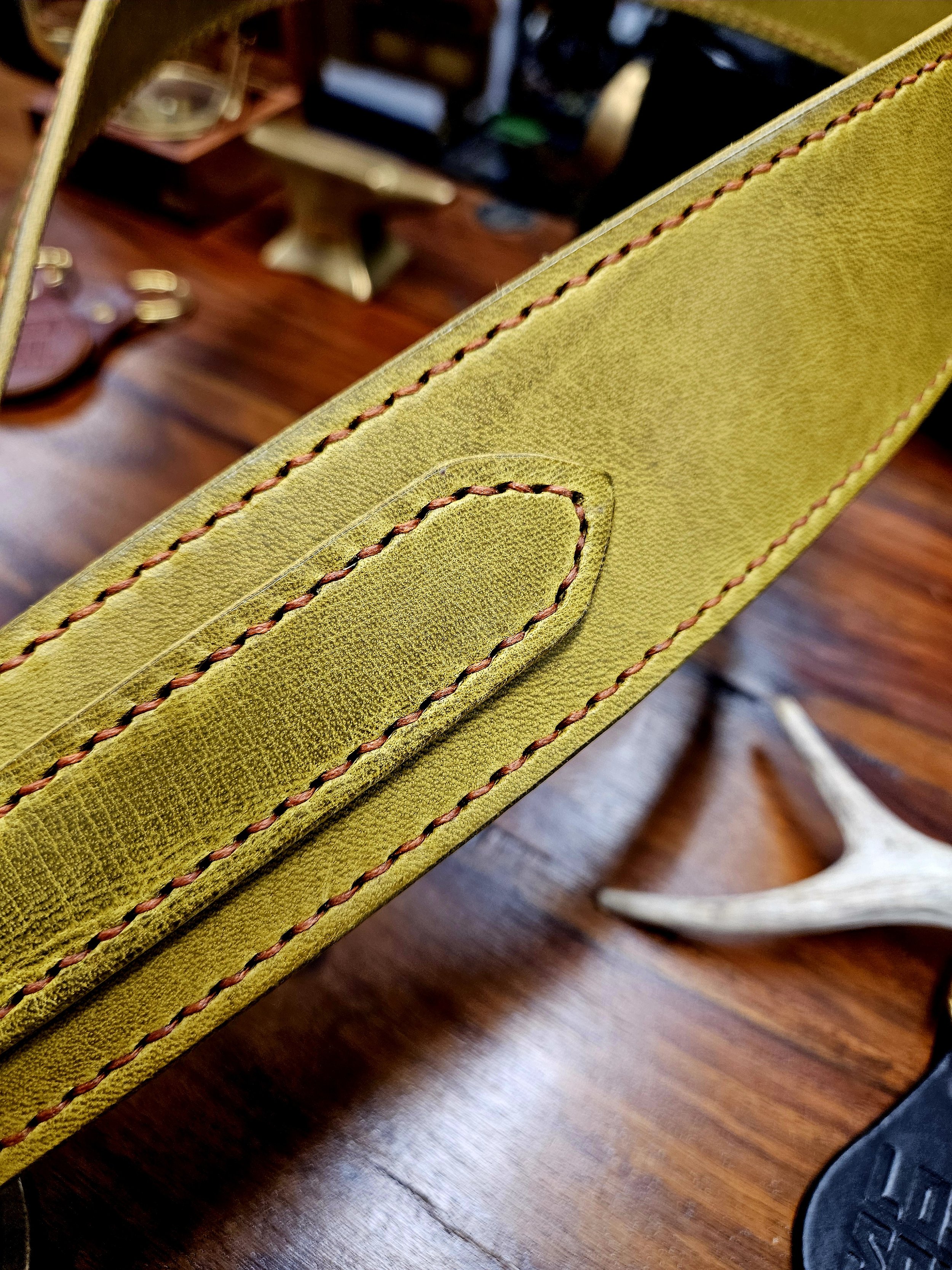 Hand made leather guitar strap. Hand stitched. Solid brass buckle. Made in UK.
