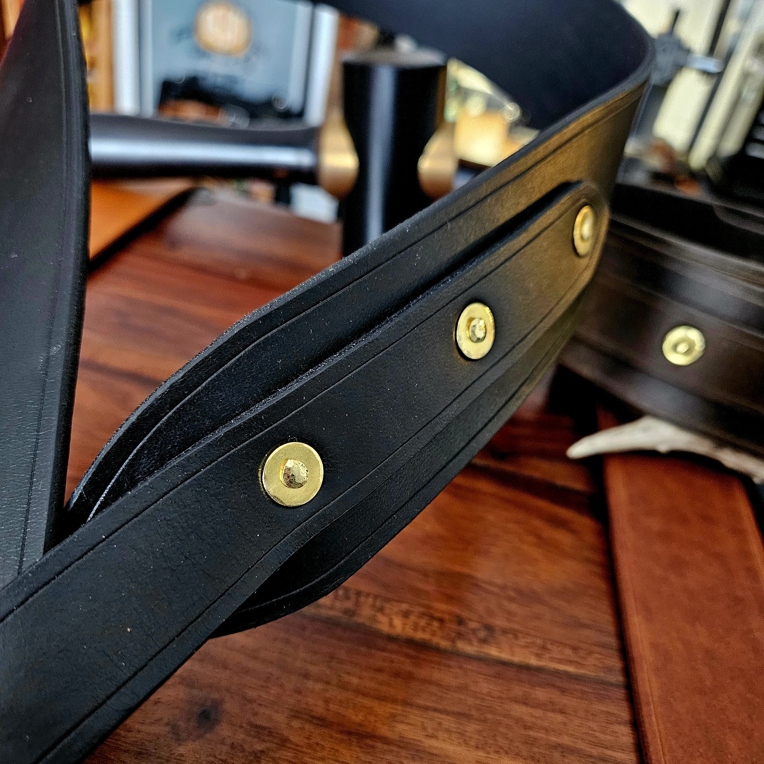 Hand made leather guitar strap. Solid Brass Buckle. Riveted. Made in UK.
