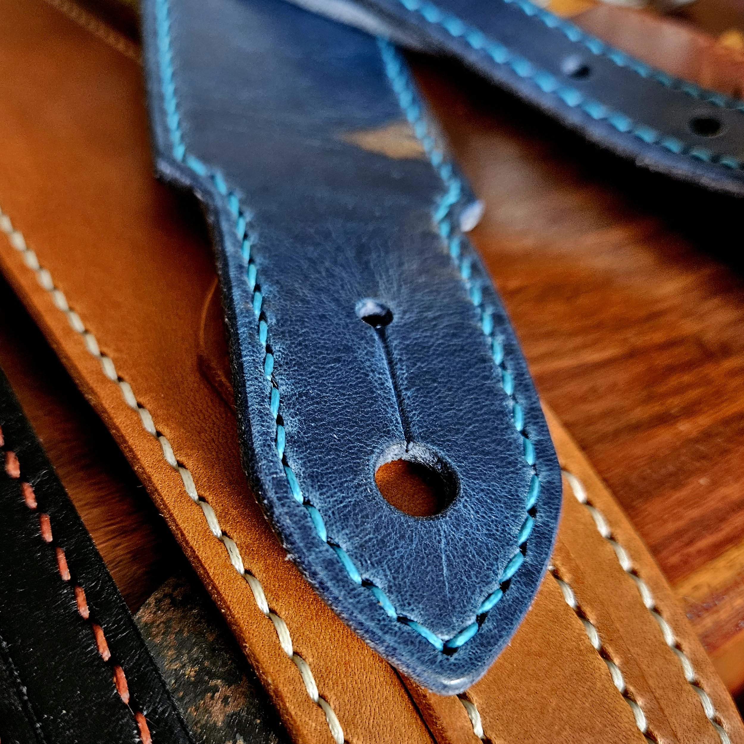 Hand made leather guitar strap. Hand stitched. Solid brass buckle. Made in UK.