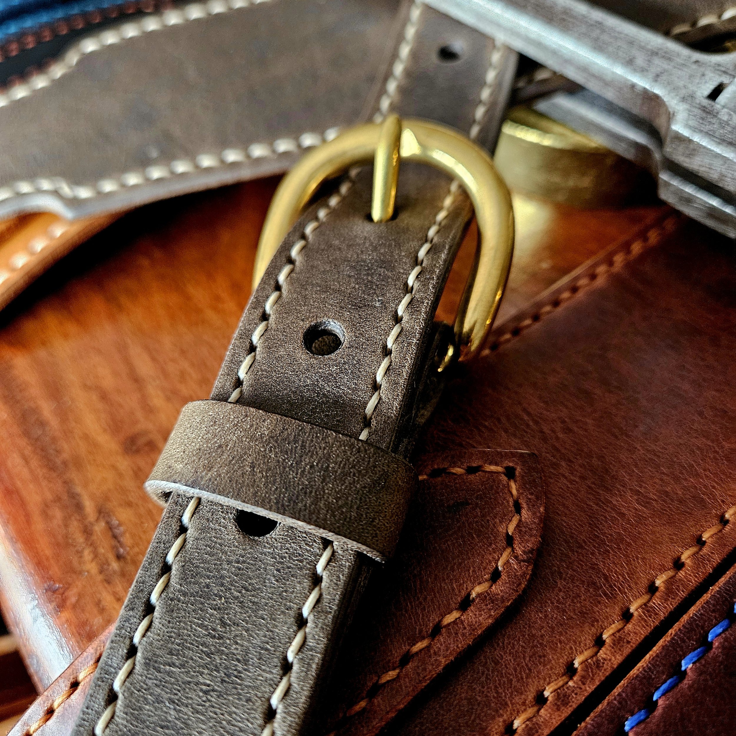 Hand made leather guitar strap. Hand stitched. Solid brass buckle. Made in UK.