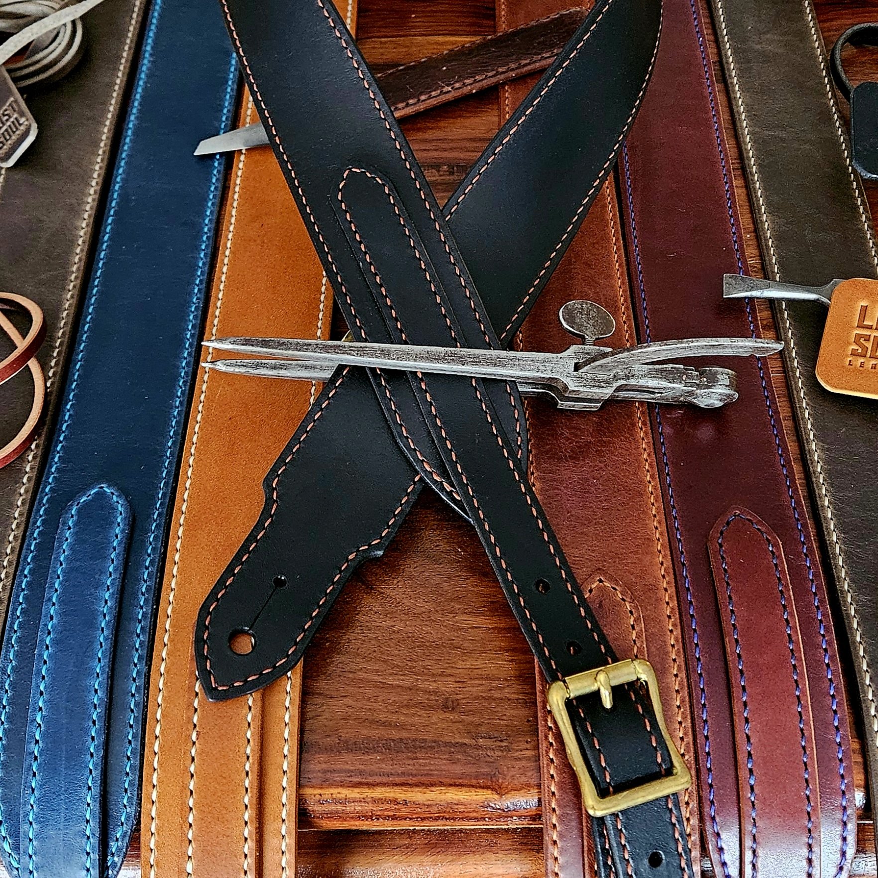 Hand made leather guitar strap. Hand stitched. Solid brass buckle. Made in UK.
