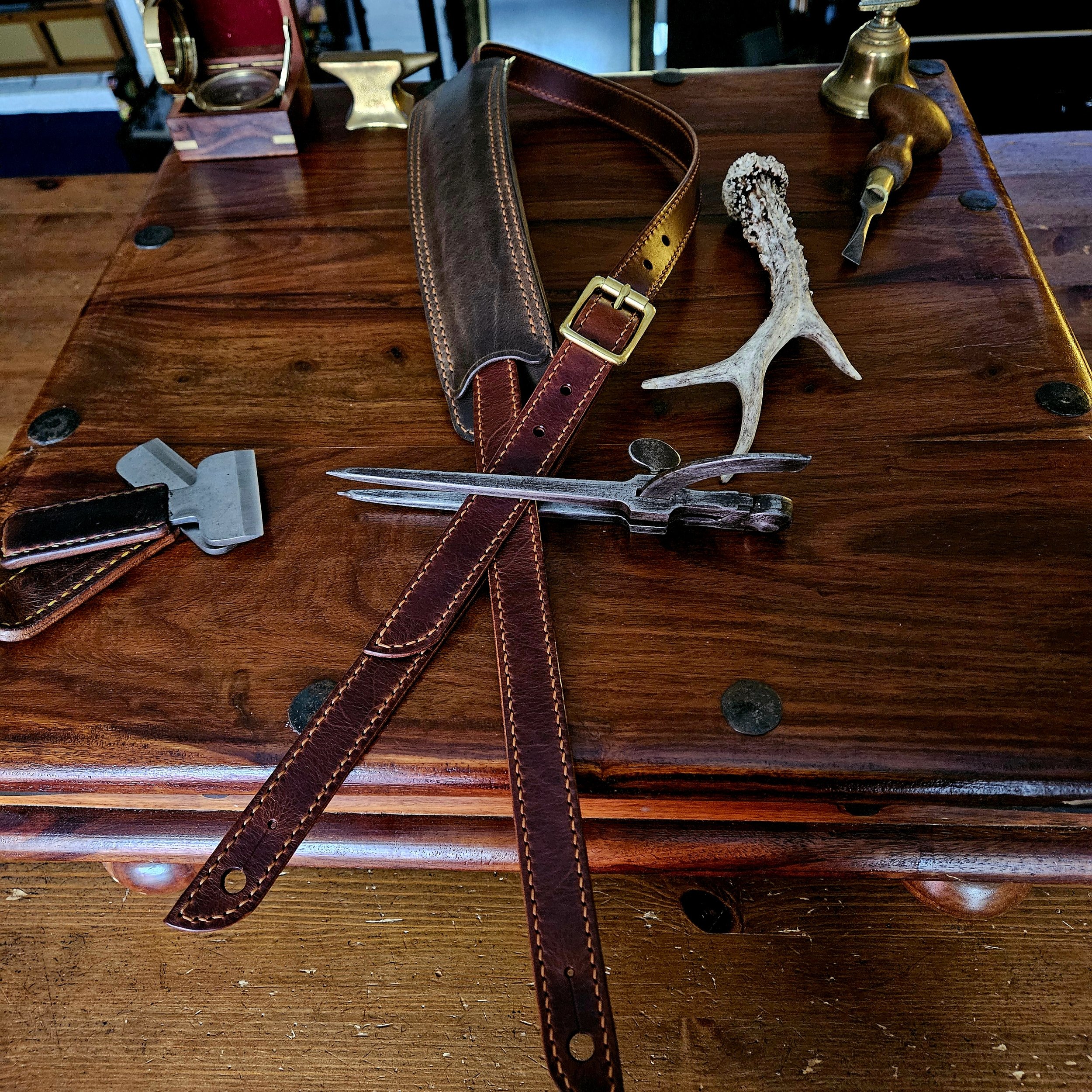 Hand made, hand stitched leather guitar strap. Highest quality UK sourced leather. Made to measure. Unique shoulder pad design.