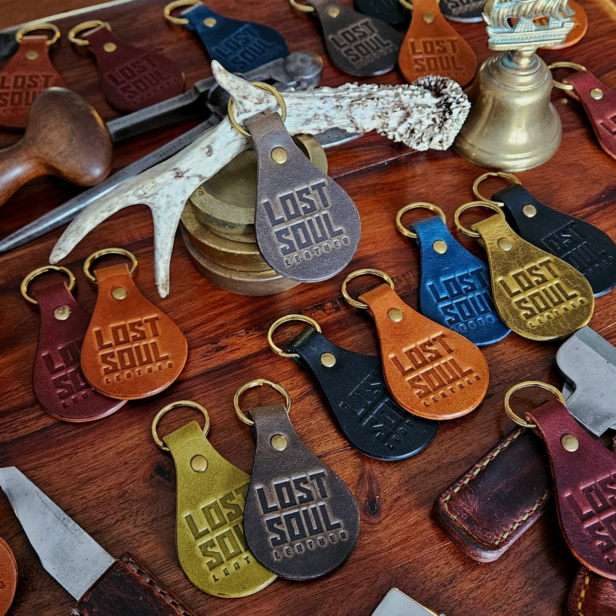 Banded key fobs and merchandise. Vegetable tanned leather. Stamped. Solid brass fittings. One of a kind. Merchandise.