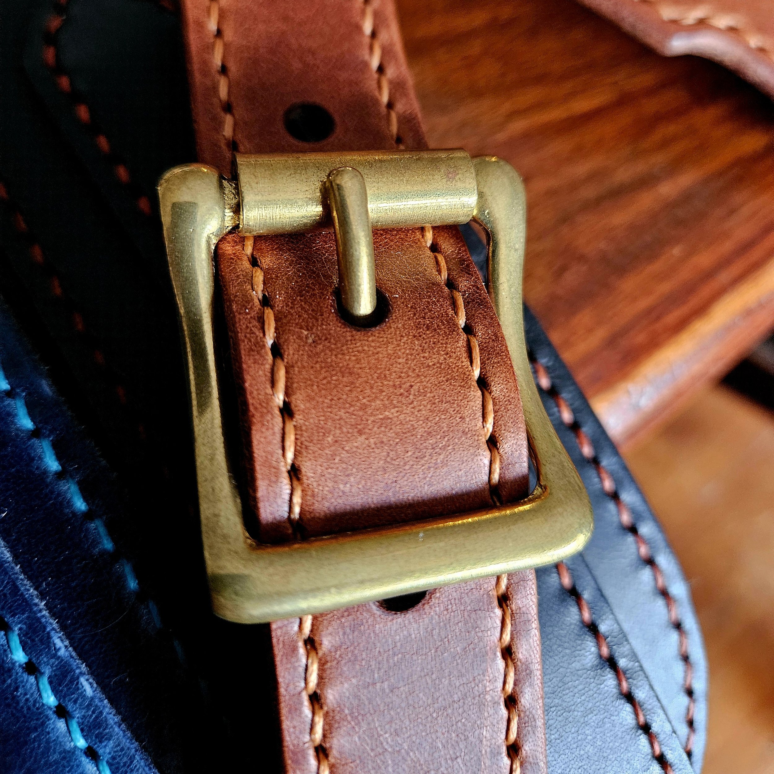 Hand made leather guitar strap. Hand stitched. Solid brass buckle. Made in UK.