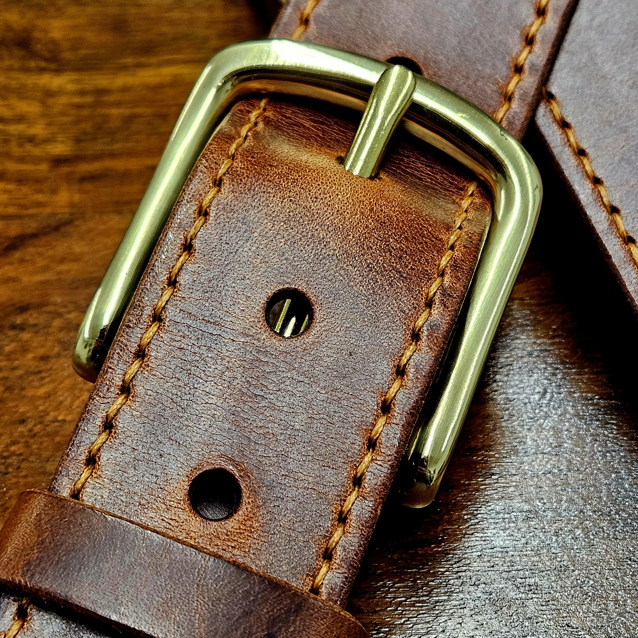 Hand made leather guitar strap. Hand stitched. Solid brass buckle. Made in UK.