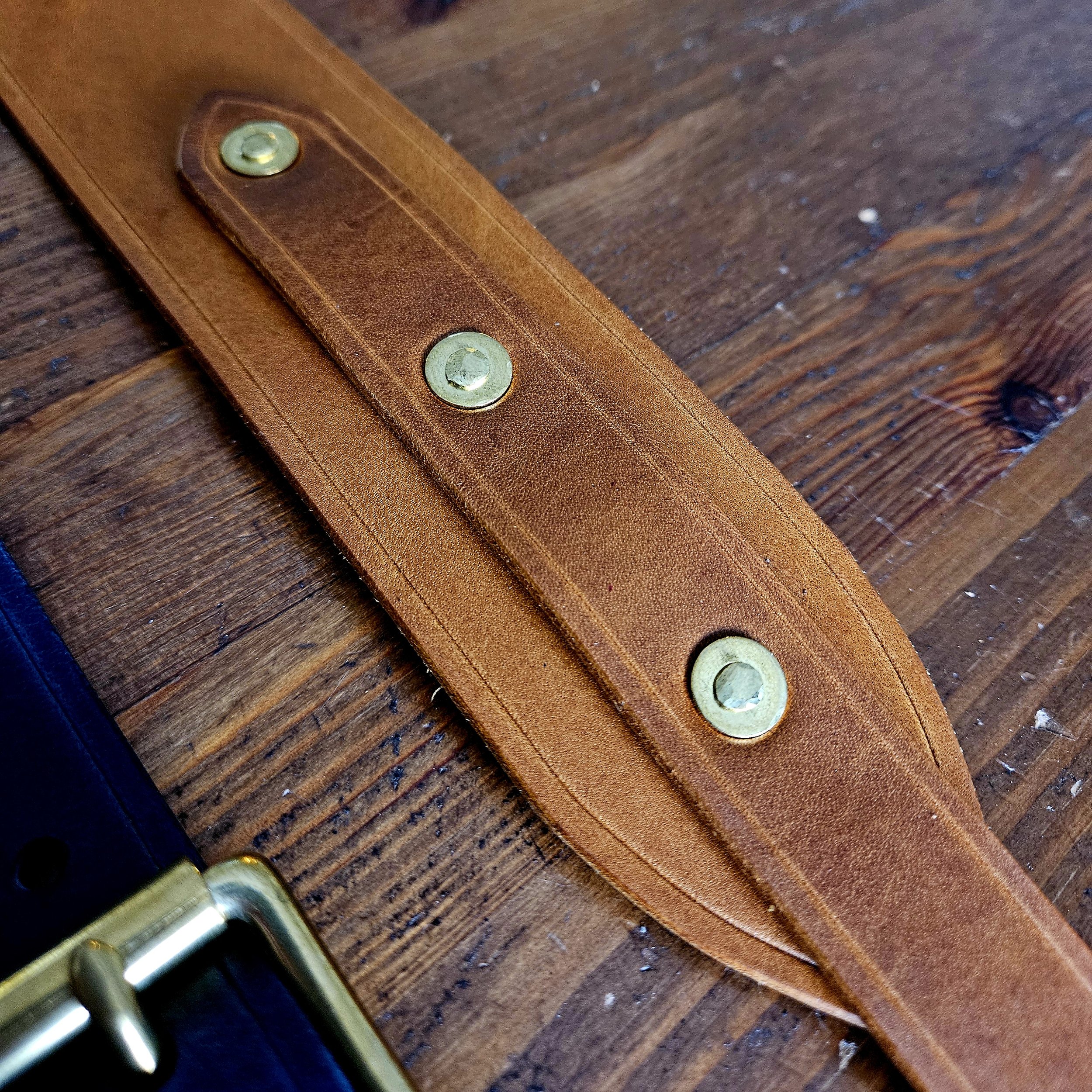 Hand made leather guitar strap. Solid Brass Buckle. Riveted. Made in UK.