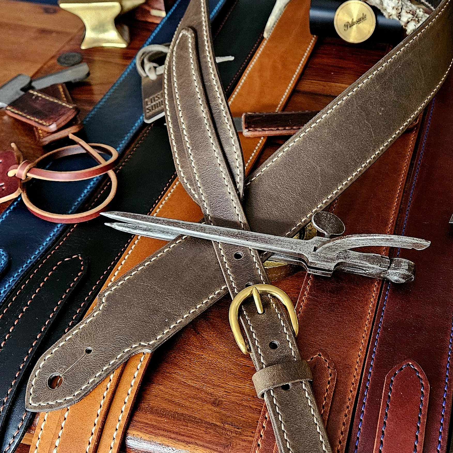 Hand made leather guitar strap. Hand stitched. Solid brass buckle. Made in UK.