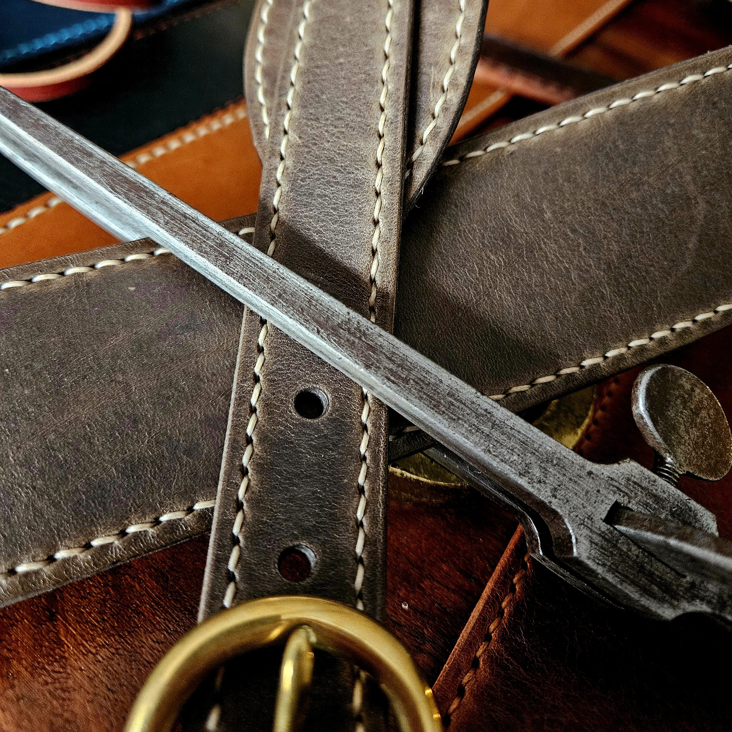 Hand made leather guitar strap. Hand stitched. Solid brass buckle. Made in UK.