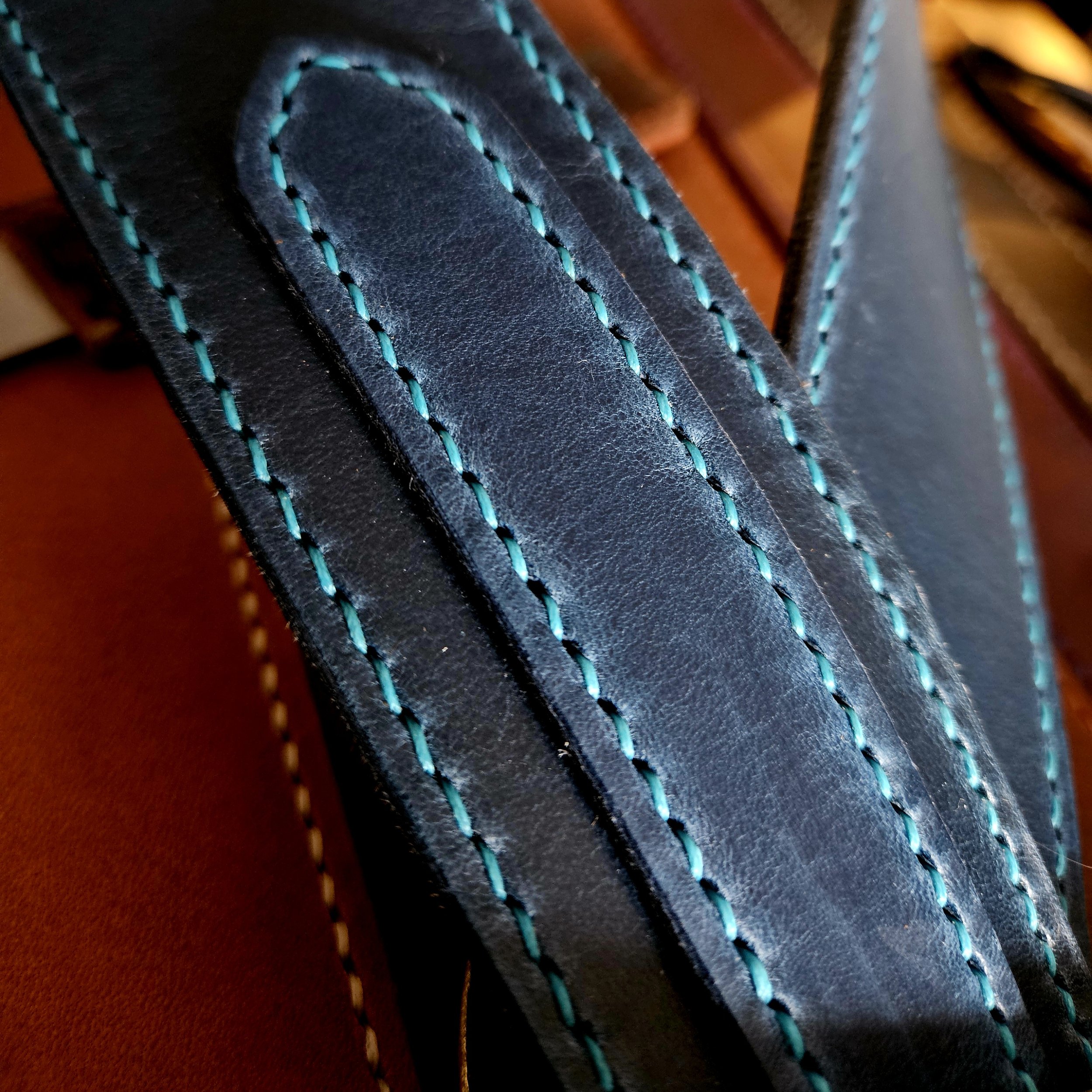 Hand made leather guitar strap. Hand stitched. Solid brass buckle. Made in UK.