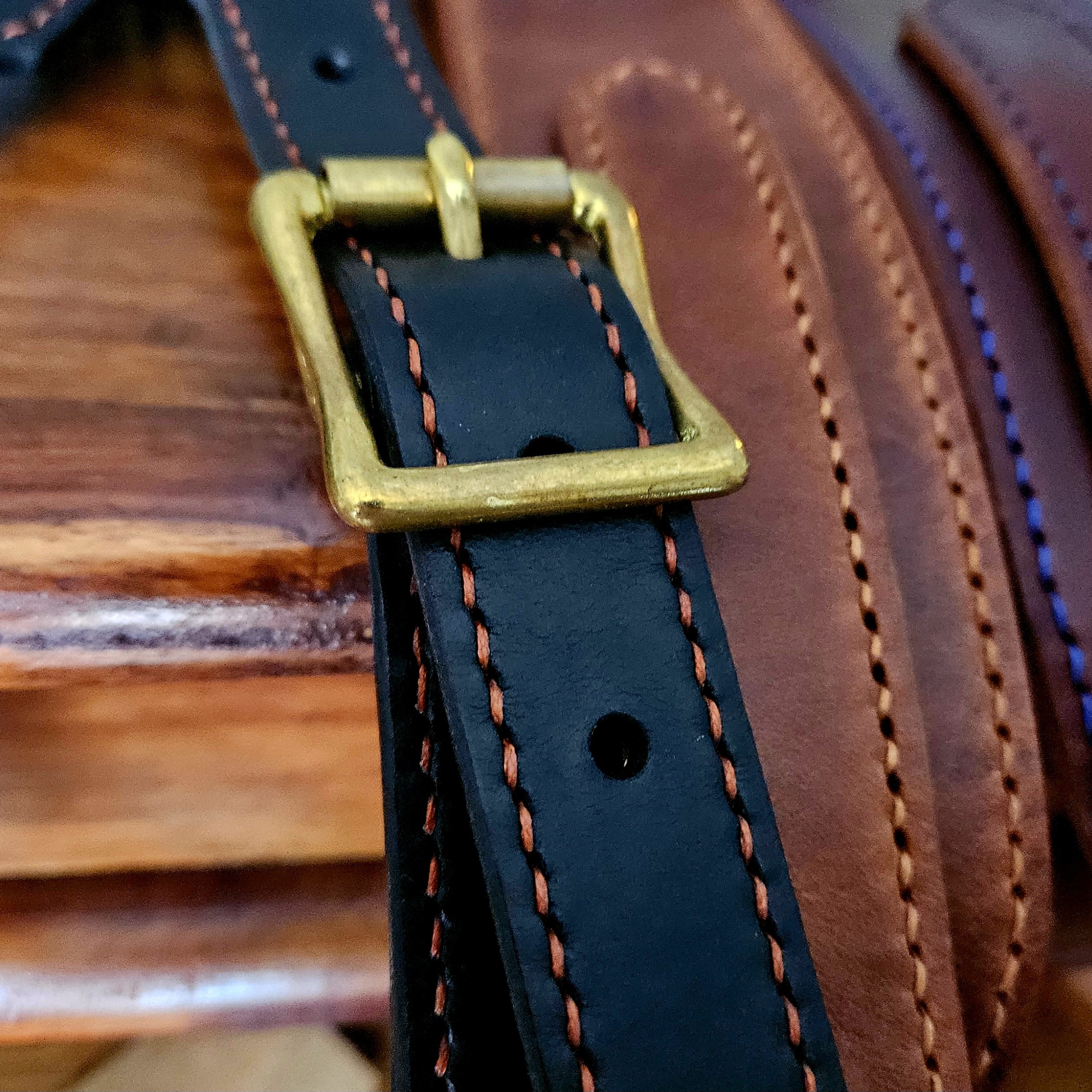 Hand made leather guitar strap. Hand stitched. Solid brass buckle. Made in UK.