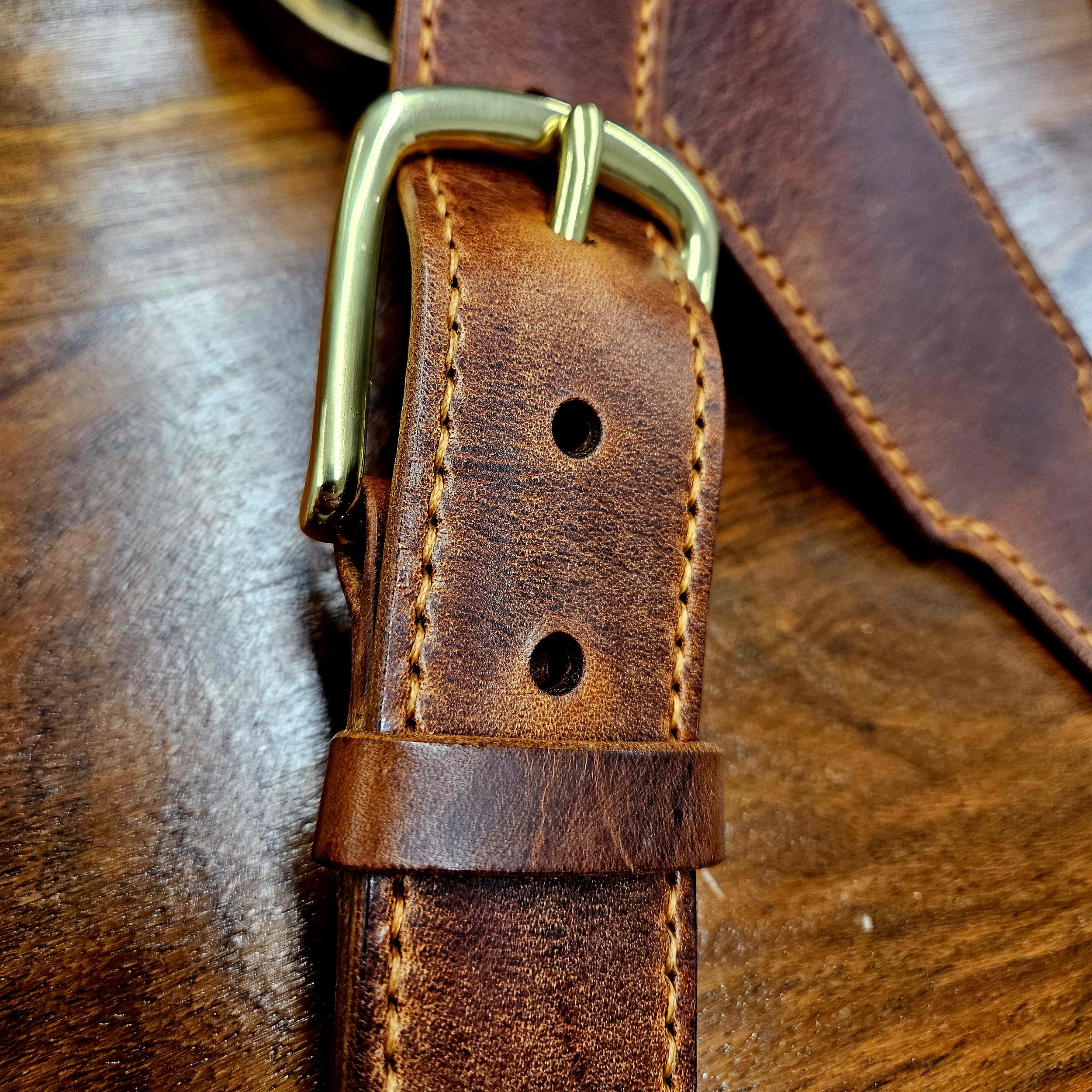 Hand made leather guitar strap. Hand stitched. Solid brass buckle. Made in UK.