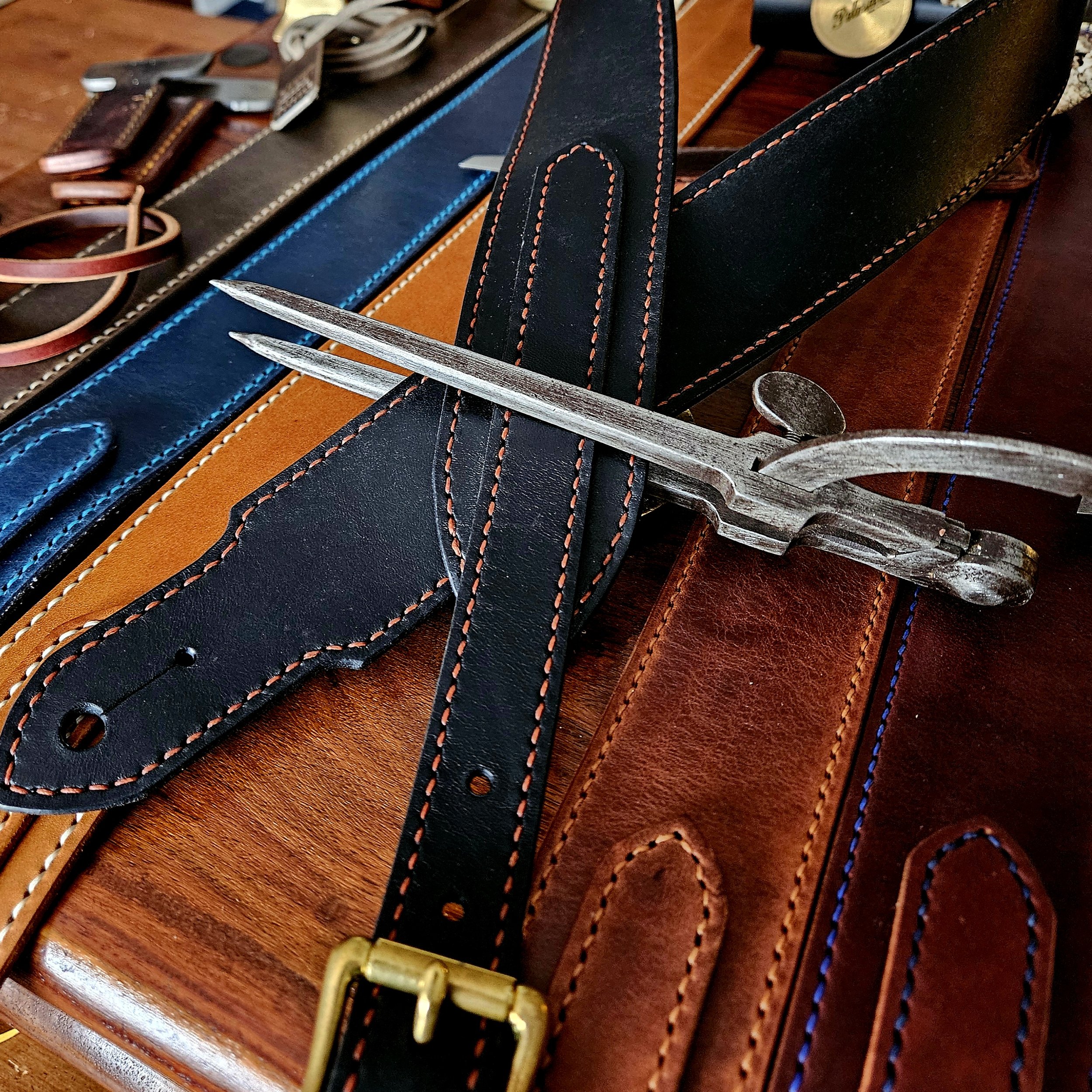 Hand made leather guitar strap. Hand stitched. Solid brass buckle. Made in UK.