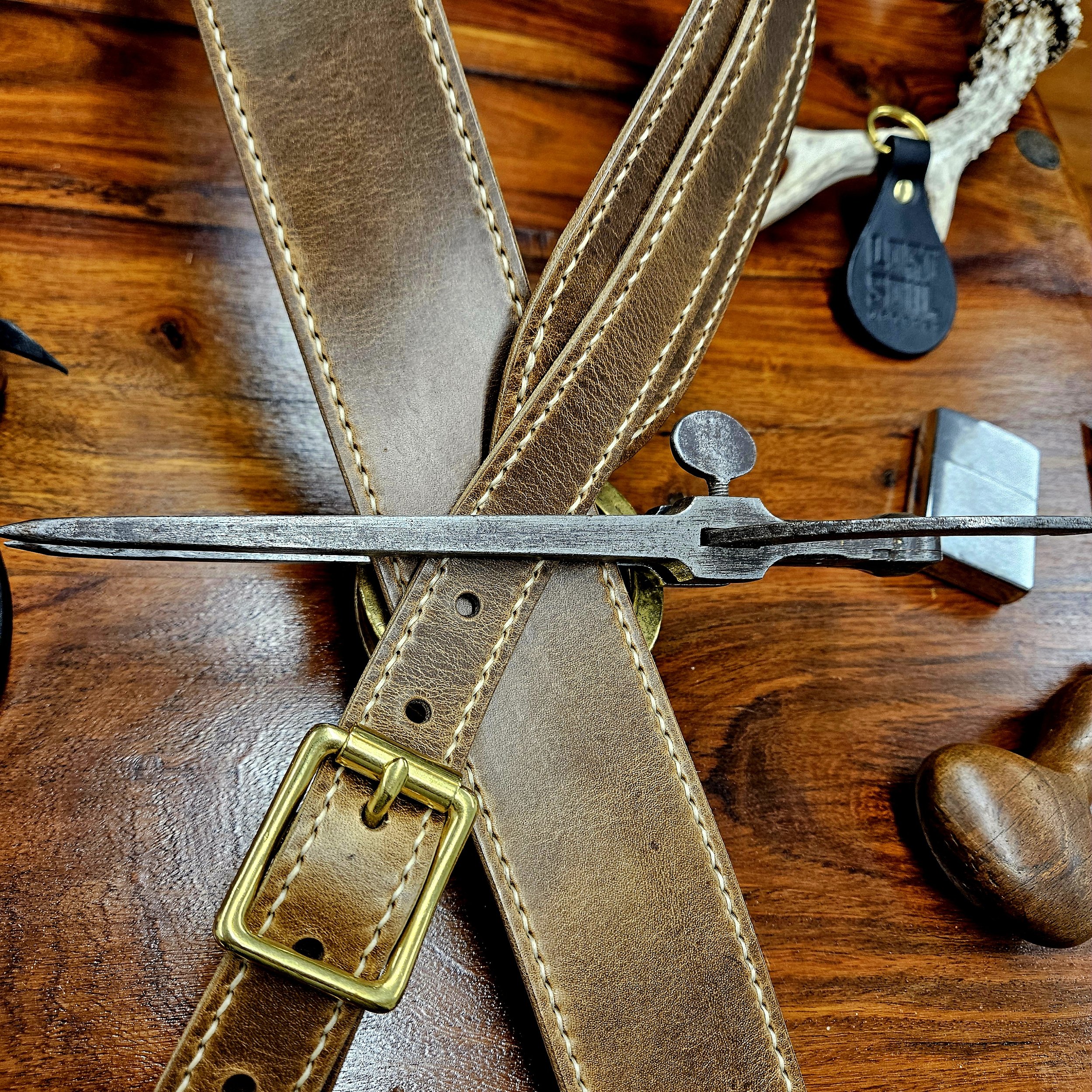 Hand made leather guitar strap. Hand stitched. Solid brass buckle. Made in UK.