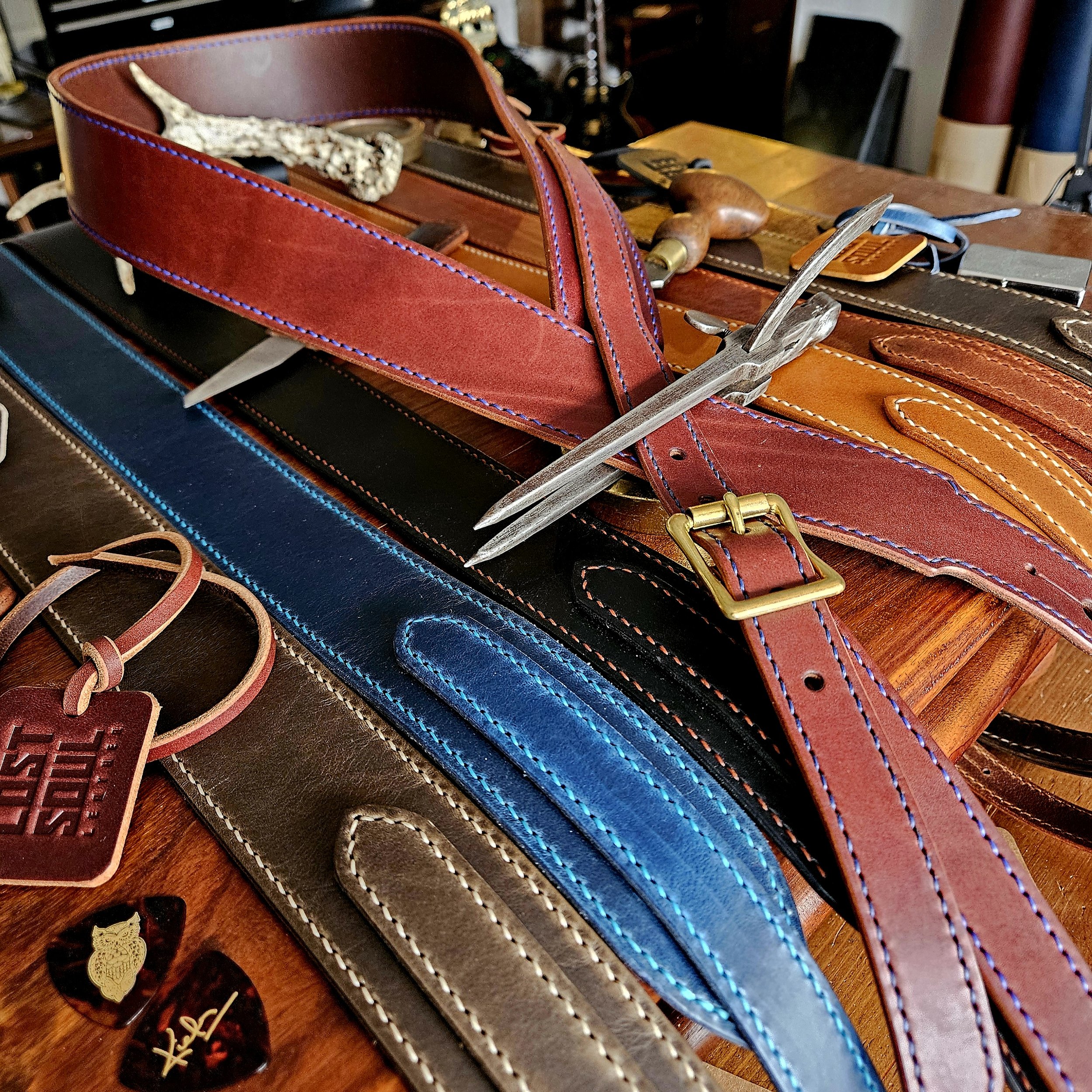 Hand made leather guitar strap. Hand stitched. Solid brass buckle. Made in UK.