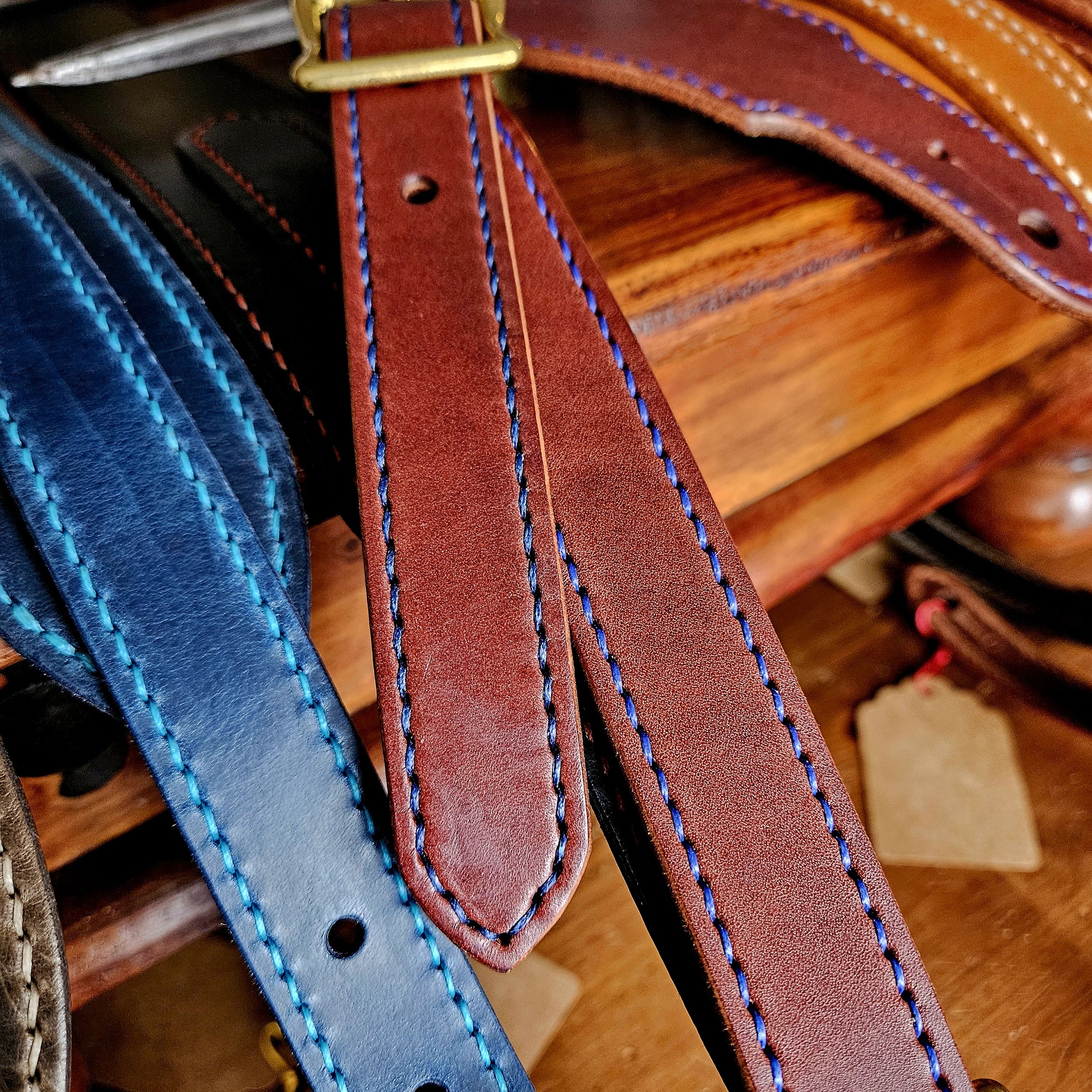 Hand made leather guitar strap. Hand stitched. Solid brass buckle. Made in UK.
