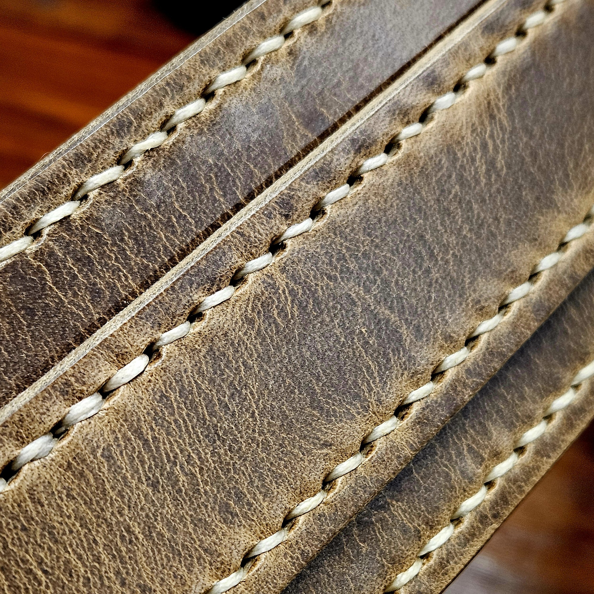 Hand made leather guitar strap. Hand stitched. Solid brass buckle. Made in UK.
