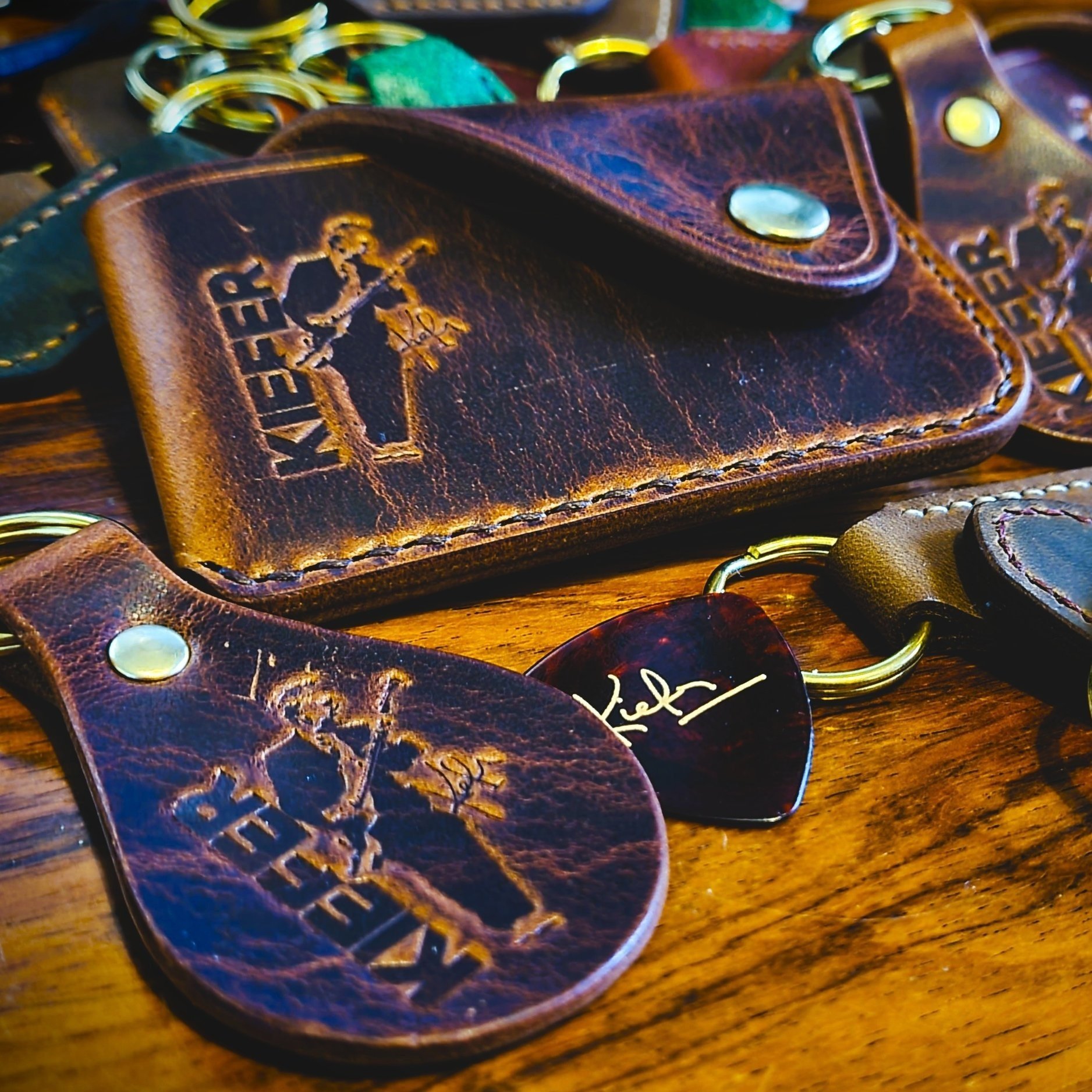 Banded key fobs and merchandise. Vegetable tanned leather. Stamped. Solid brass fittings. One of a kind. Merchandise.