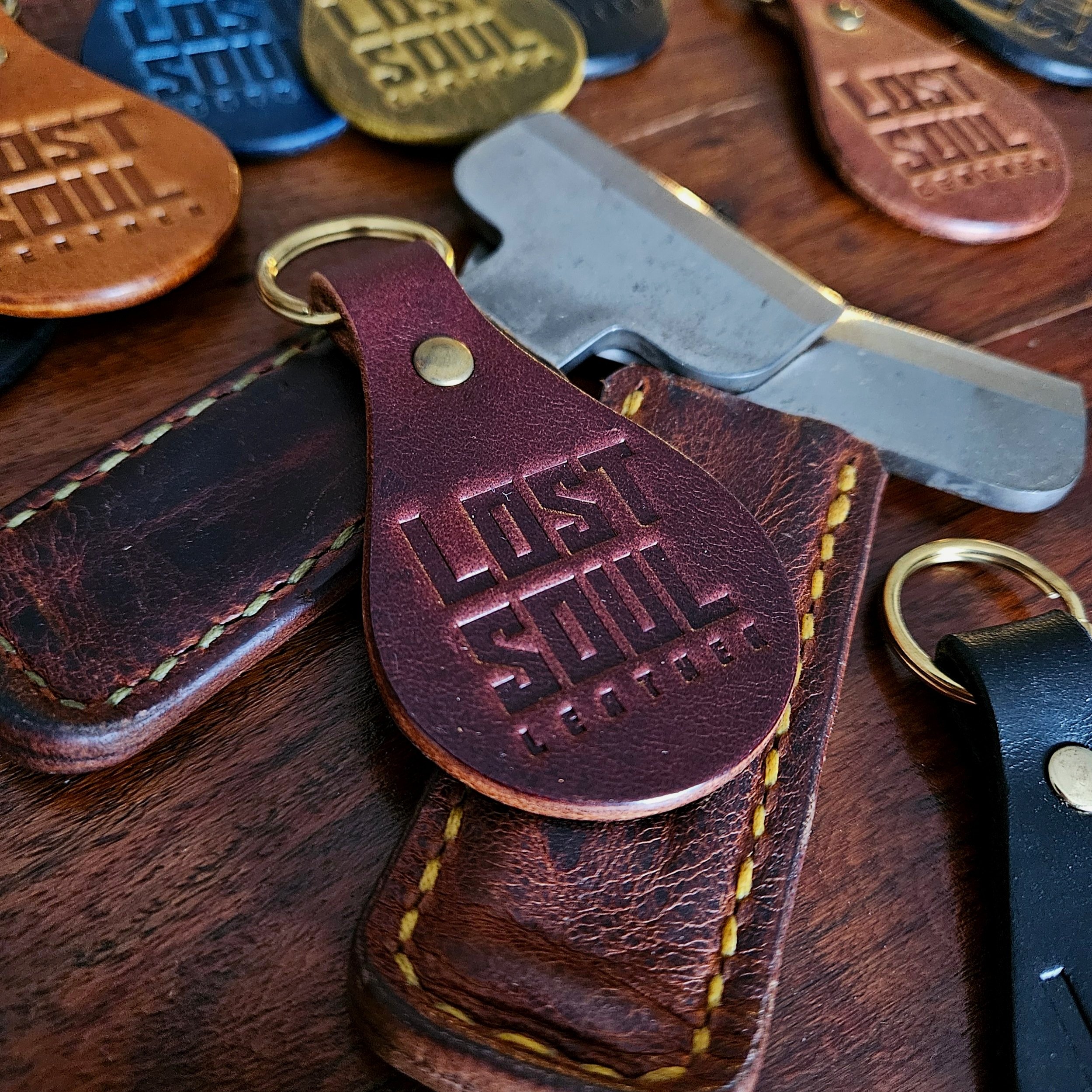 Banded key fobs and merchandise. Vegetable tanned leather. Stamped. Solid brass fittings. One of a kind. Merchandise.