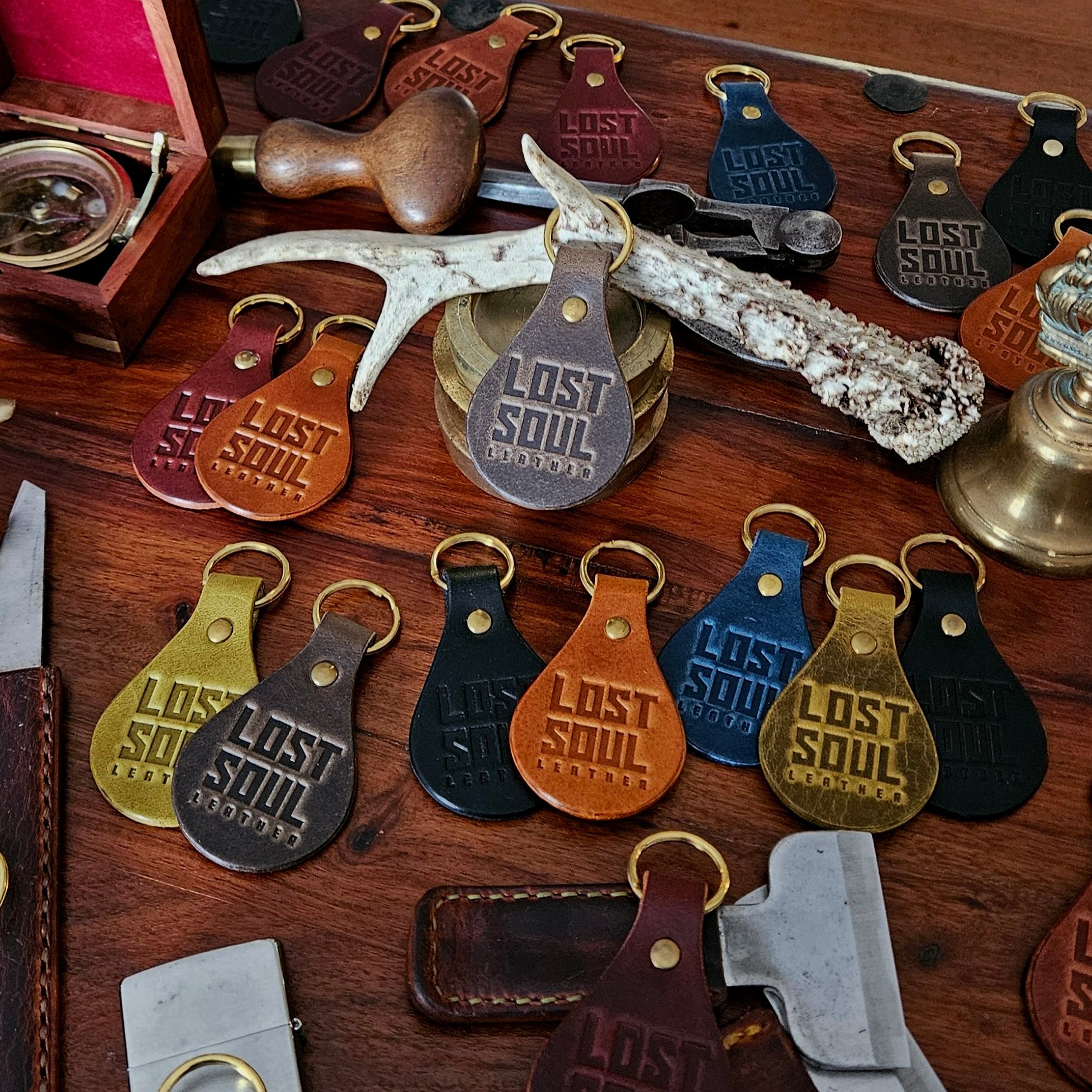 Banded key fobs and merchandise. Vegetable tanned leather. Stamped. Solid brass fittings. One of a kind. Merchandise.