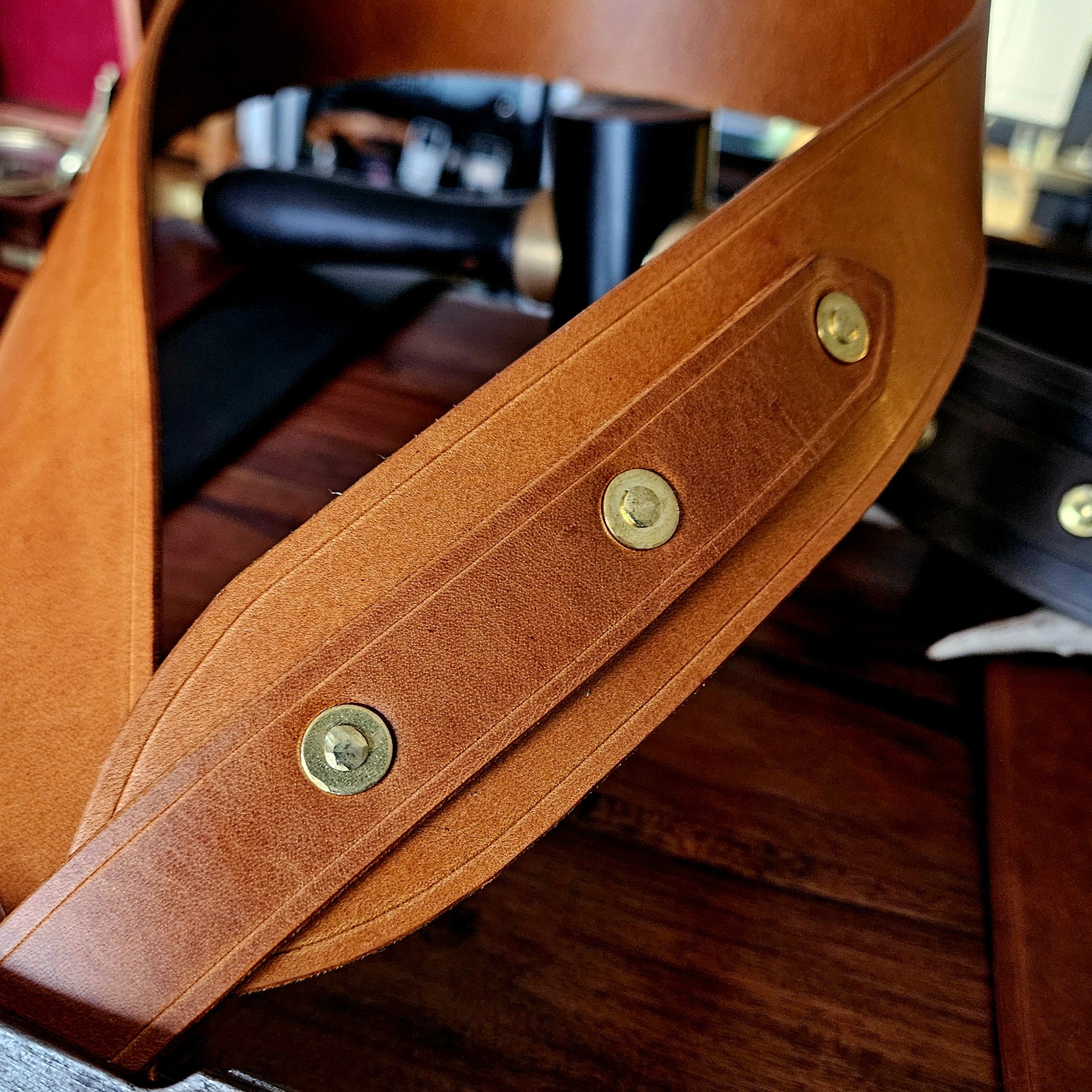 Hand made leather guitar strap. Solid Brass Buckle. Riveted. Made in UK.
