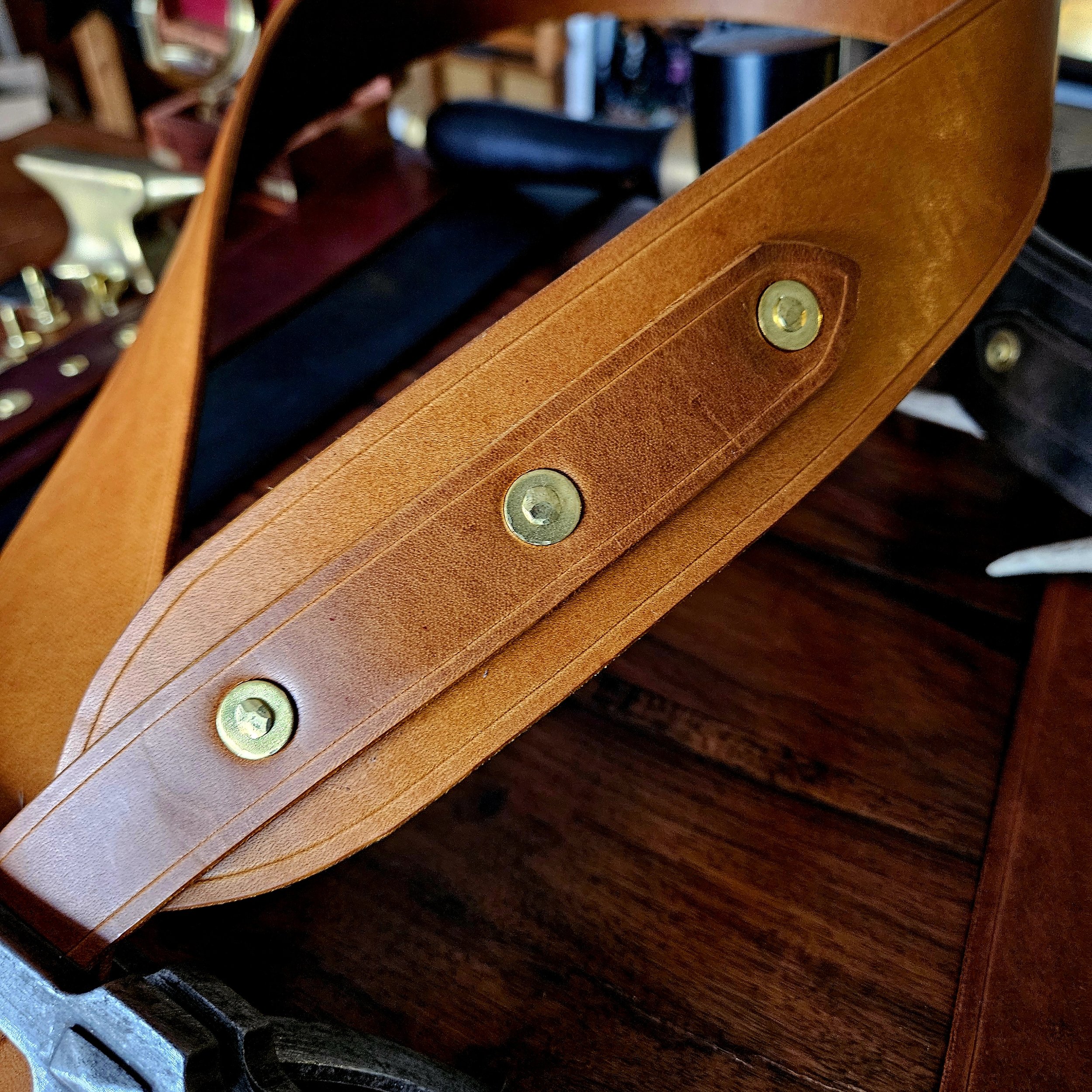 Hand made leather guitar strap. Solid Brass Buckle. Riveted. Made in UK.