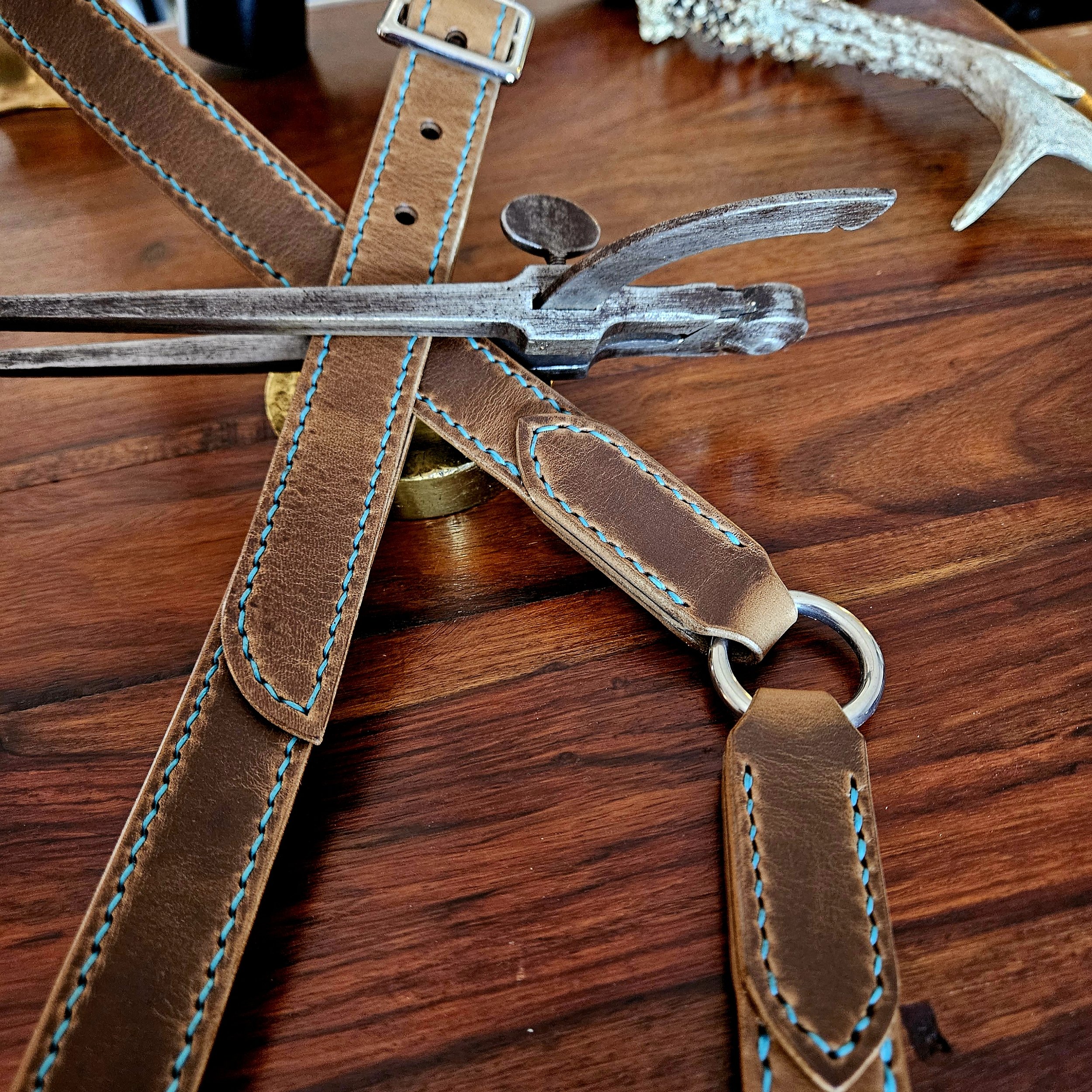 Hand made, hand stitched leather guitar strap. Highest quality UK sourced leather. Made to measure. Decorative ring design.