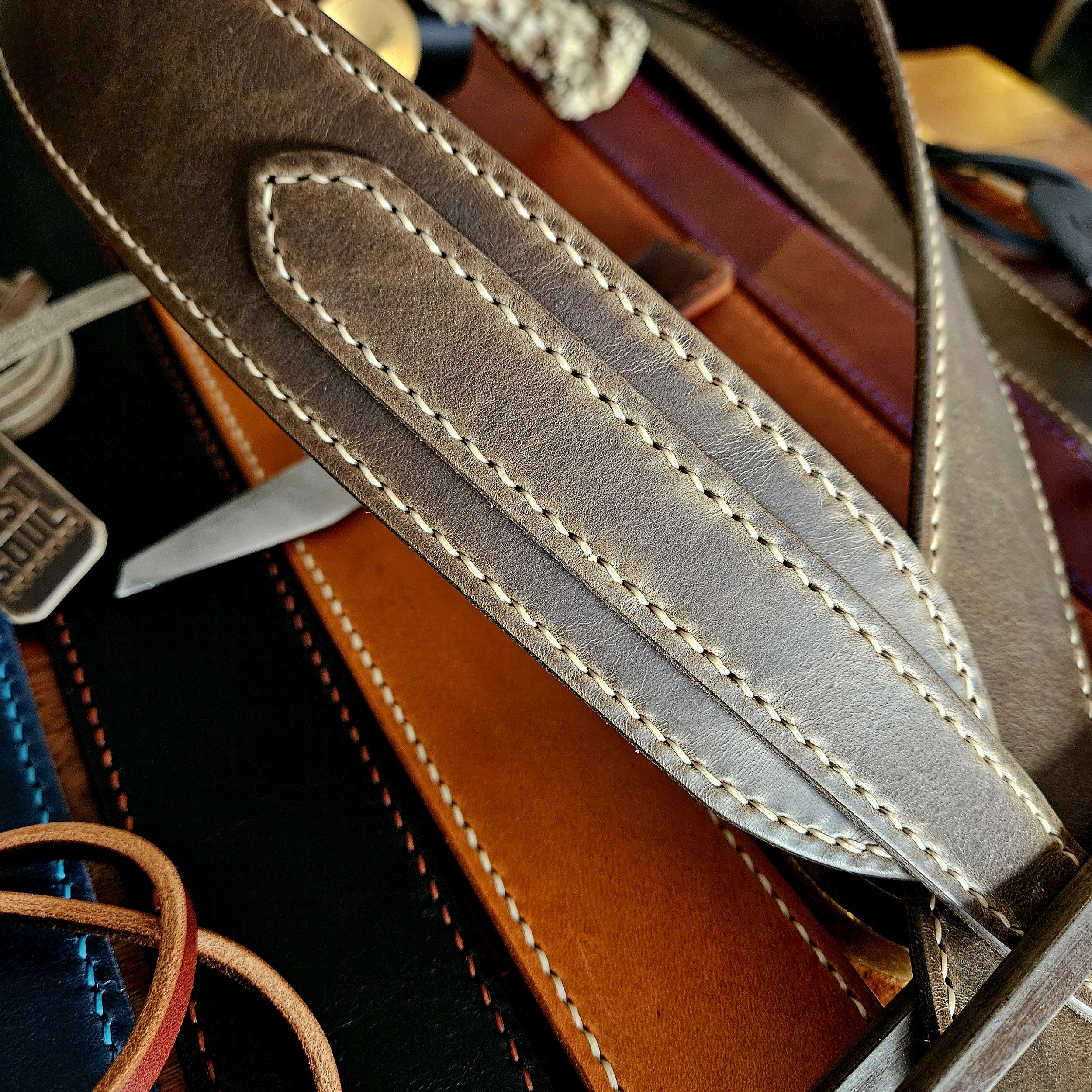 Hand made leather guitar strap. Hand stitched. Solid brass buckle. Made in UK.