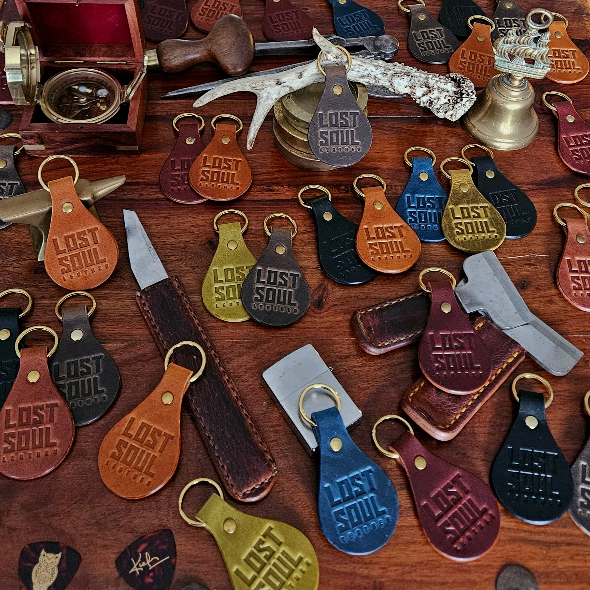 Banded key fobs and merchandise. Vegetable tanned leather. Stamped. Solid brass fittings. One of a kind. Merchandise.