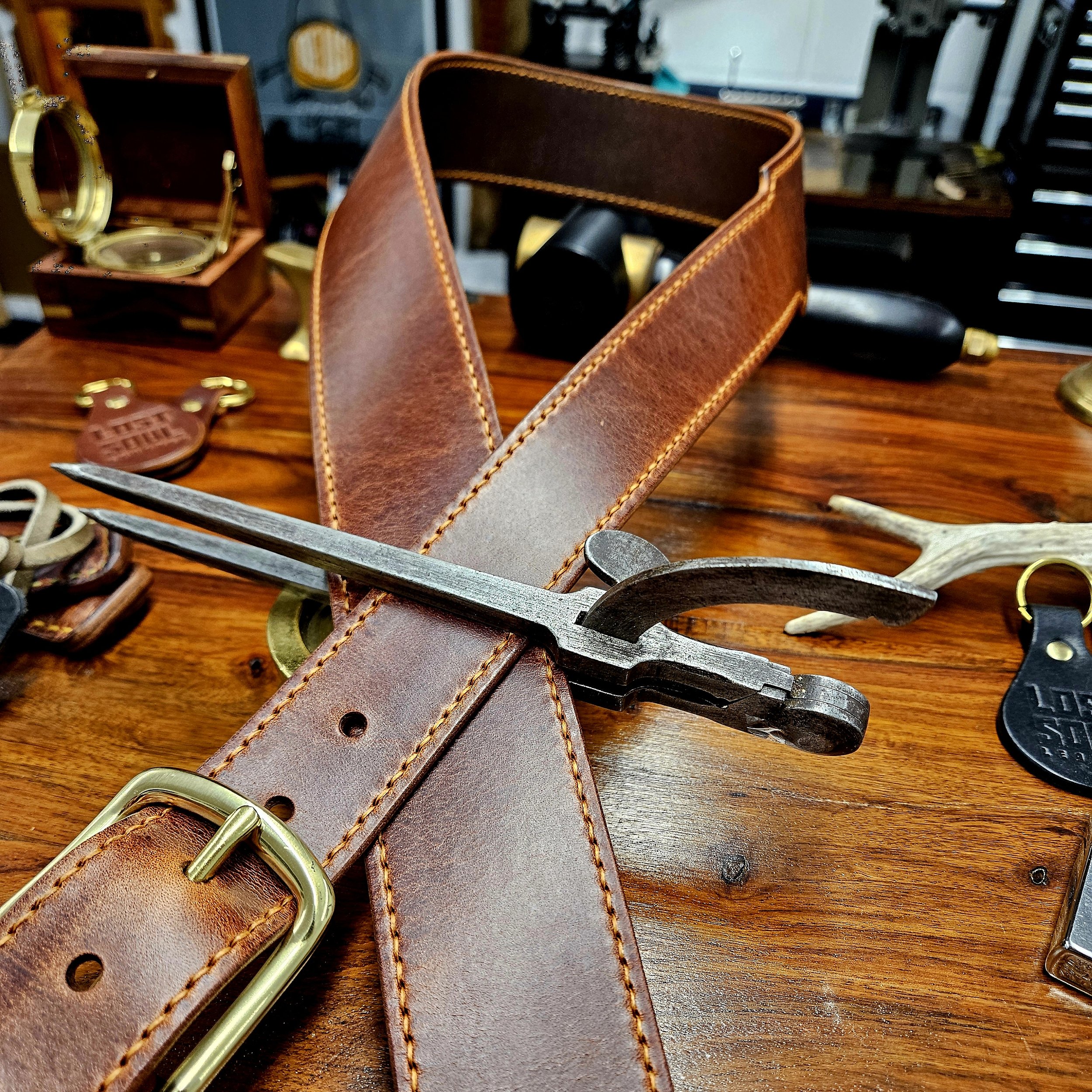Hand made leather guitar strap. Hand stitched. Solid brass buckle. Made in UK.