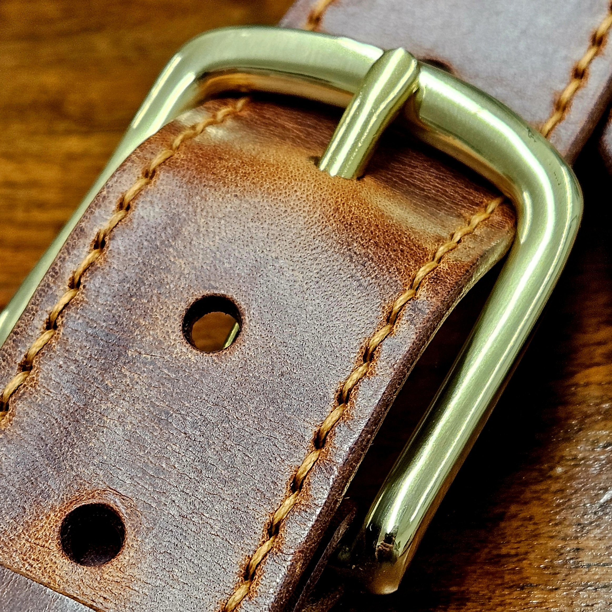 Hand made leather guitar strap. Hand stitched. Solid brass buckle. Made in UK.