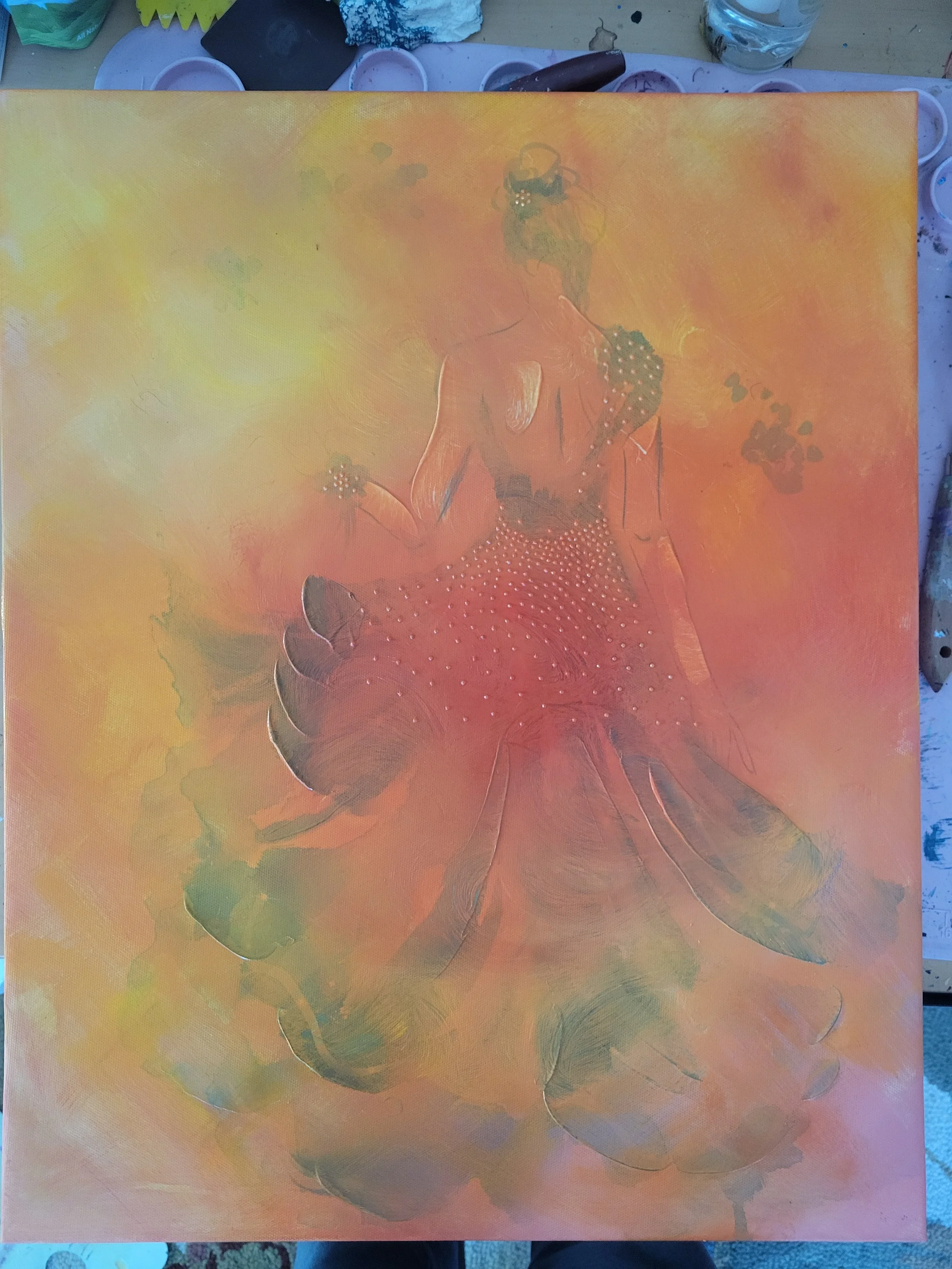 First layer showing orange, yellow, red paint layered over a thrifted canvas.