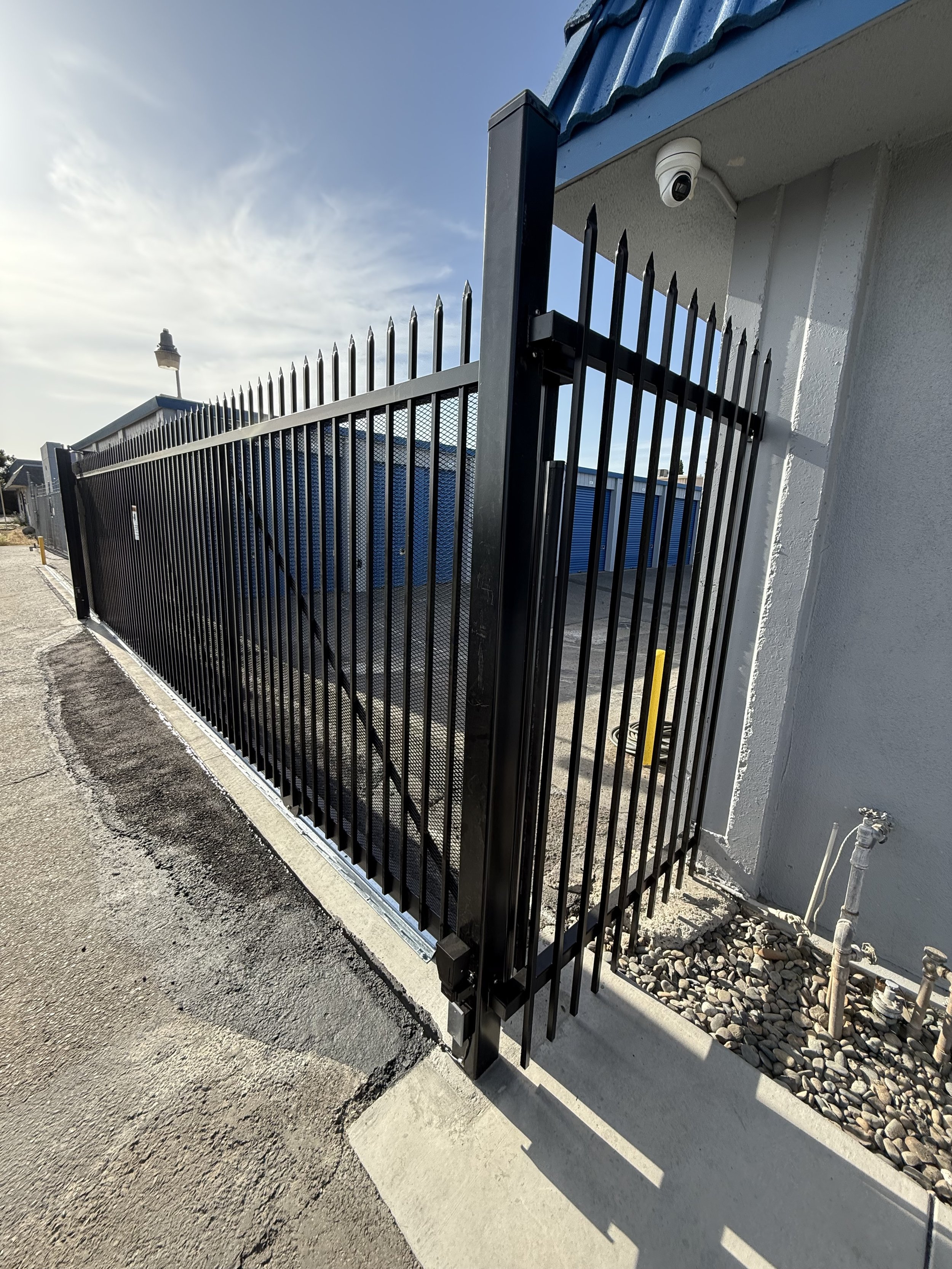 Custom sliding gate system with electric motor and smooth track installation for Sacramento business