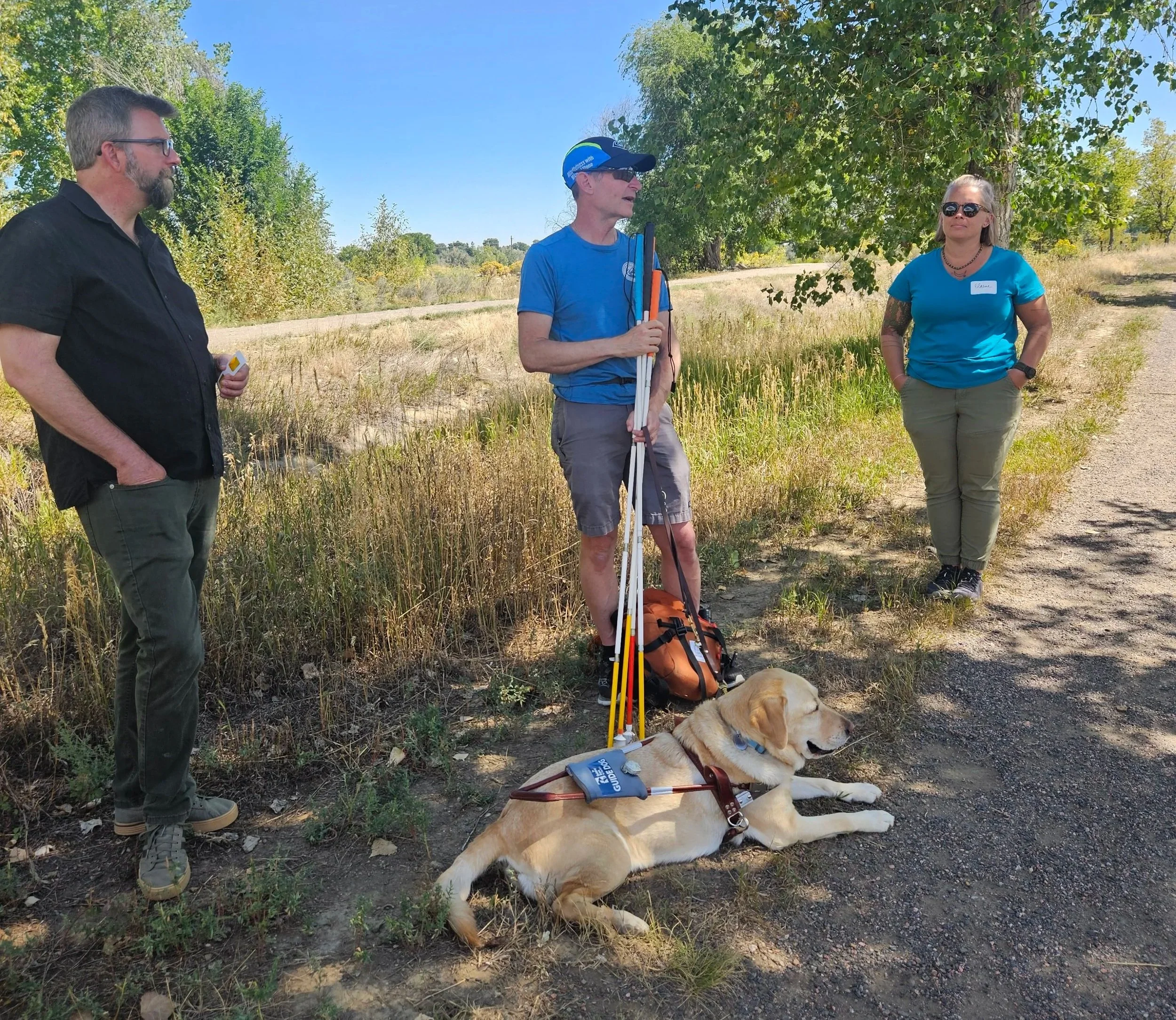 Mike Stone leading a talk with local officials on a trail about safety for the VI community