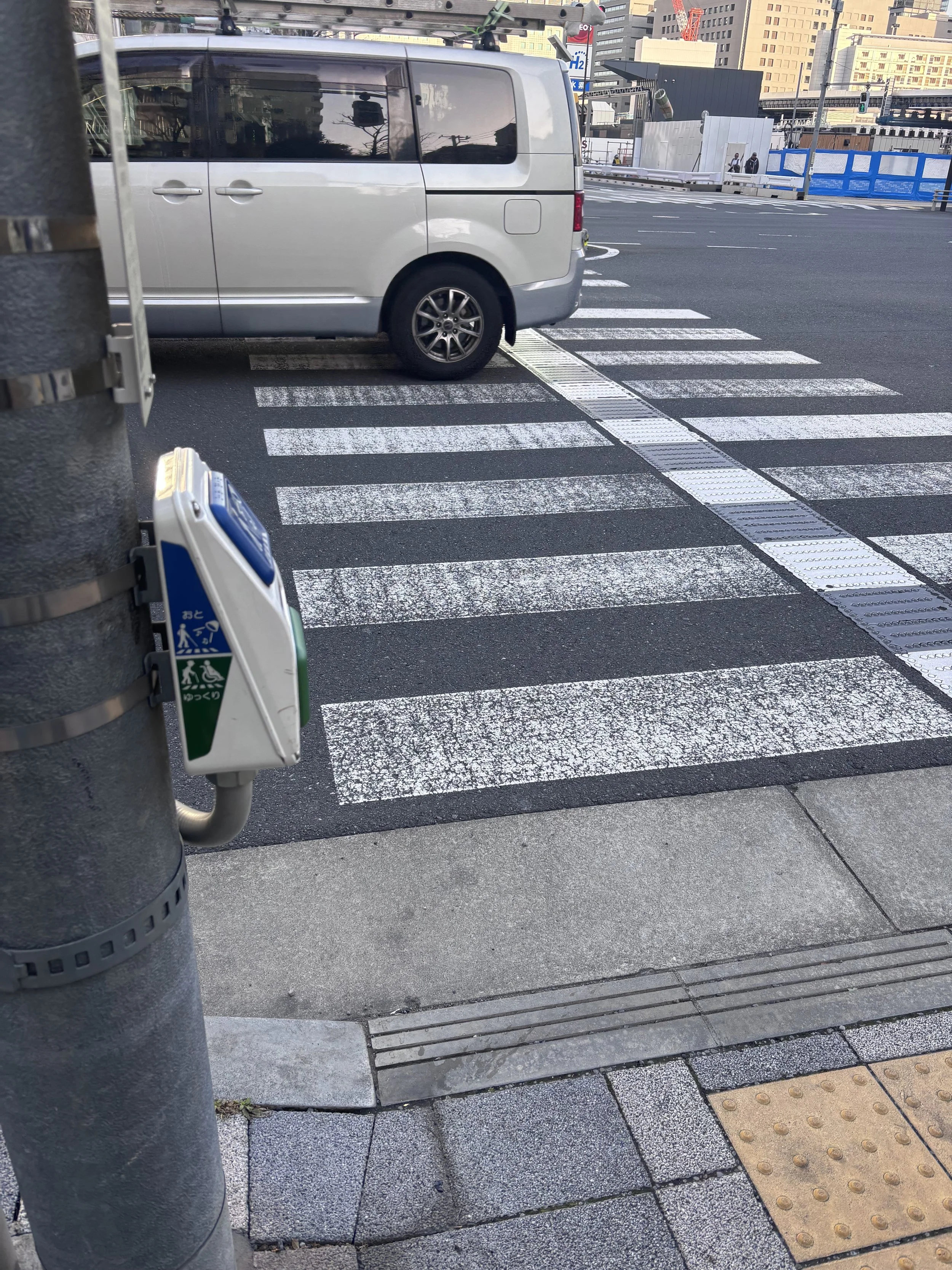 tactile paving along the crosswalk for people with visual impairments