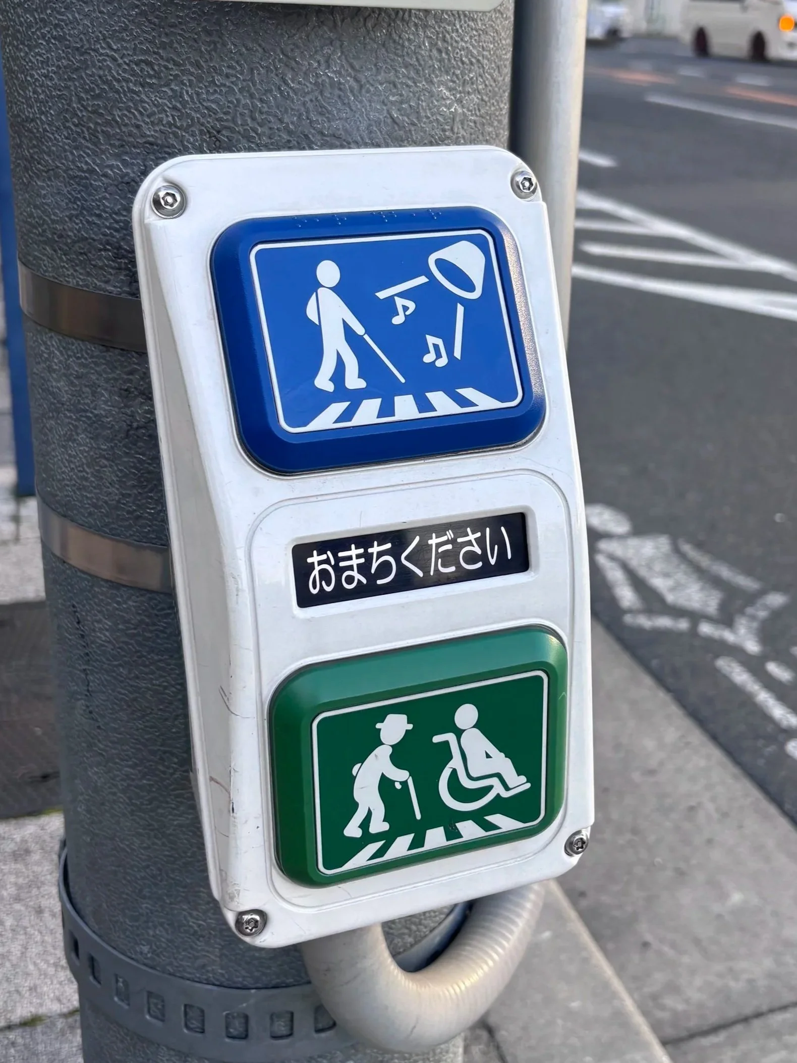 accessible buttons at crosswalk for more time and auditory signal