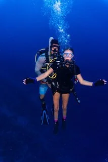 Zoe scuba diving with her dad