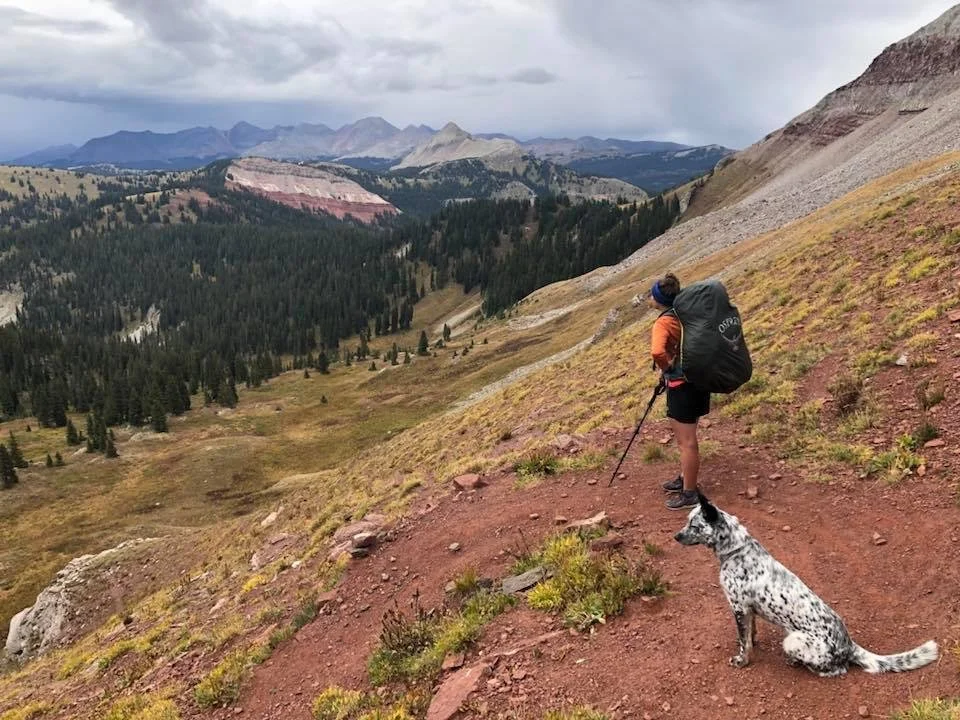 Aska (my dog) and I looking out over the San Juan Mountains