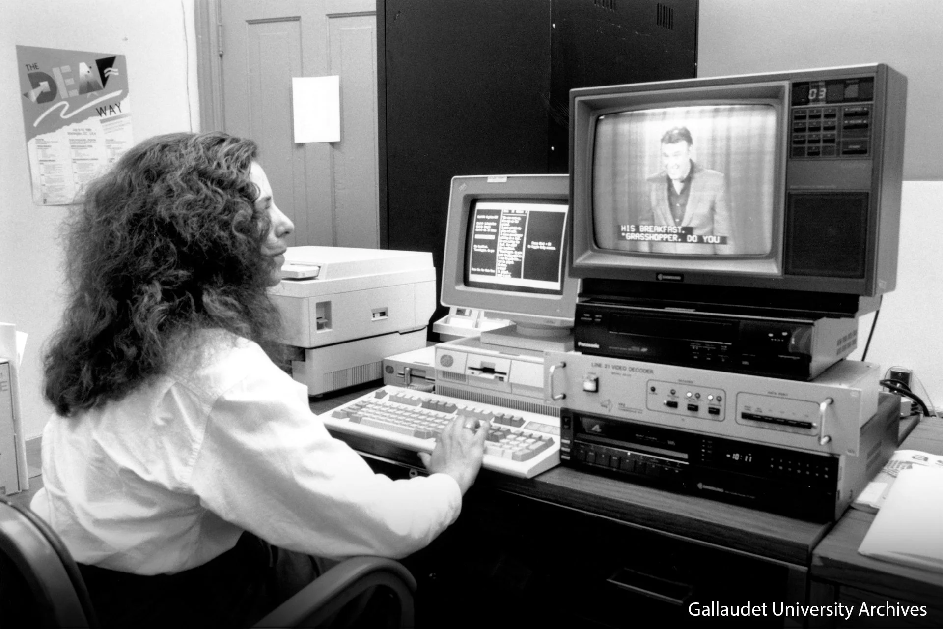 A woman is typing the closed captioning text while watching at TV show