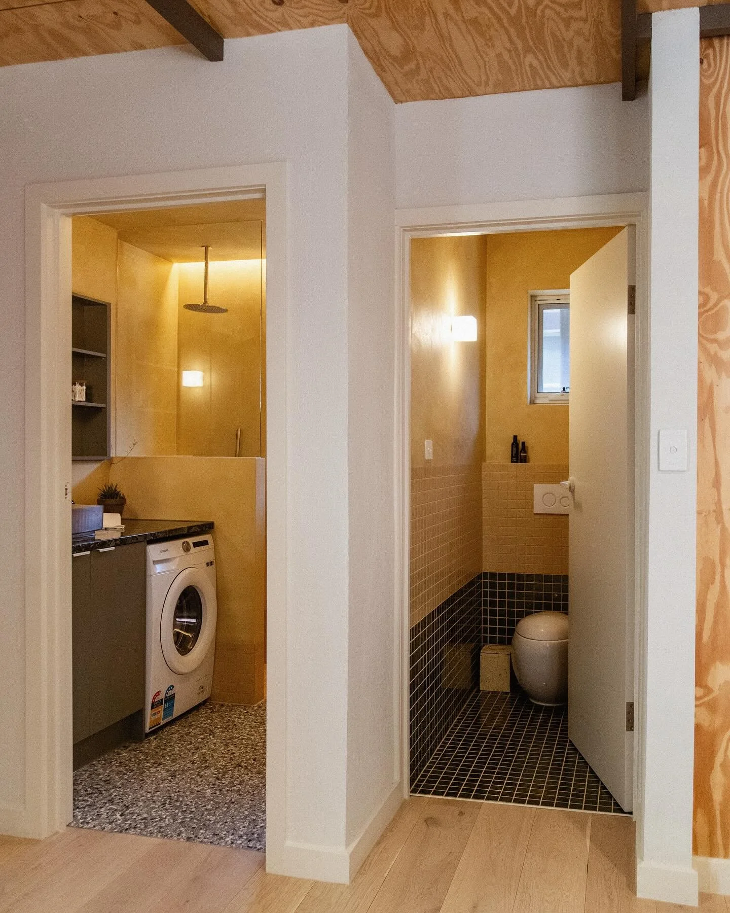 Blyth St - We set out to make the most of this compact 4.2m&sup2; footprint&mdash;recessed storage, set back washer, and durable finishes throughout. Warm-toned micro cement wraps the walls and ceiling for a seamless, hand-finished feel, with recesse