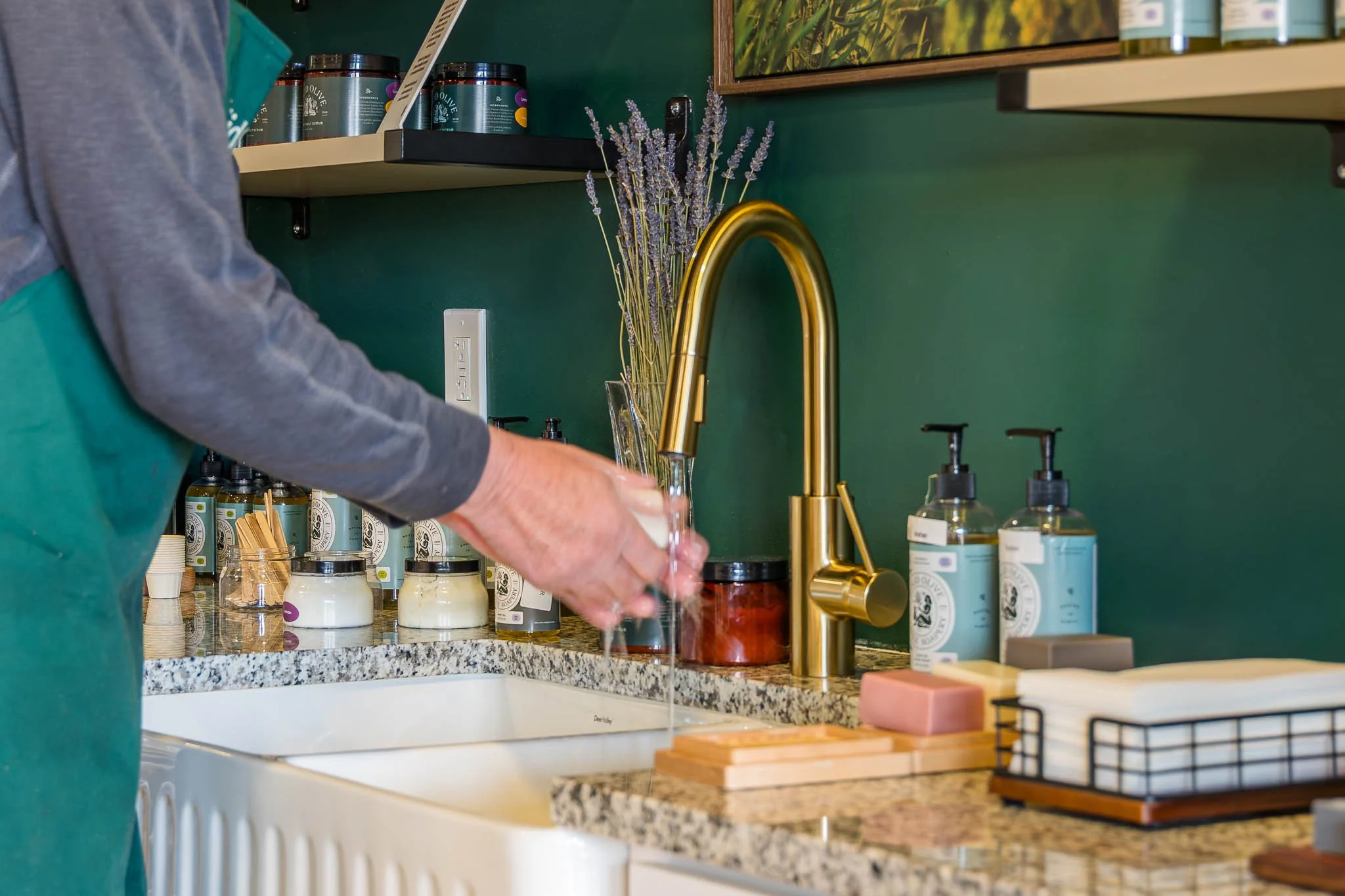 close shot of person washing hand with solid olive soap