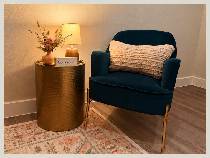 Blue armchair beside a lamp and side table in a counseling room at Living in Legacy Counseling in Red Oak, TX.