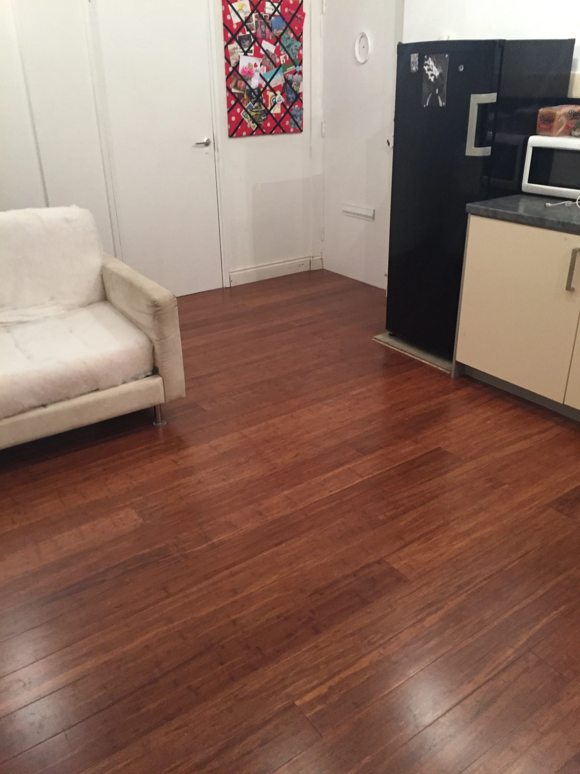Hardwood flooring installed in a refurbished living room