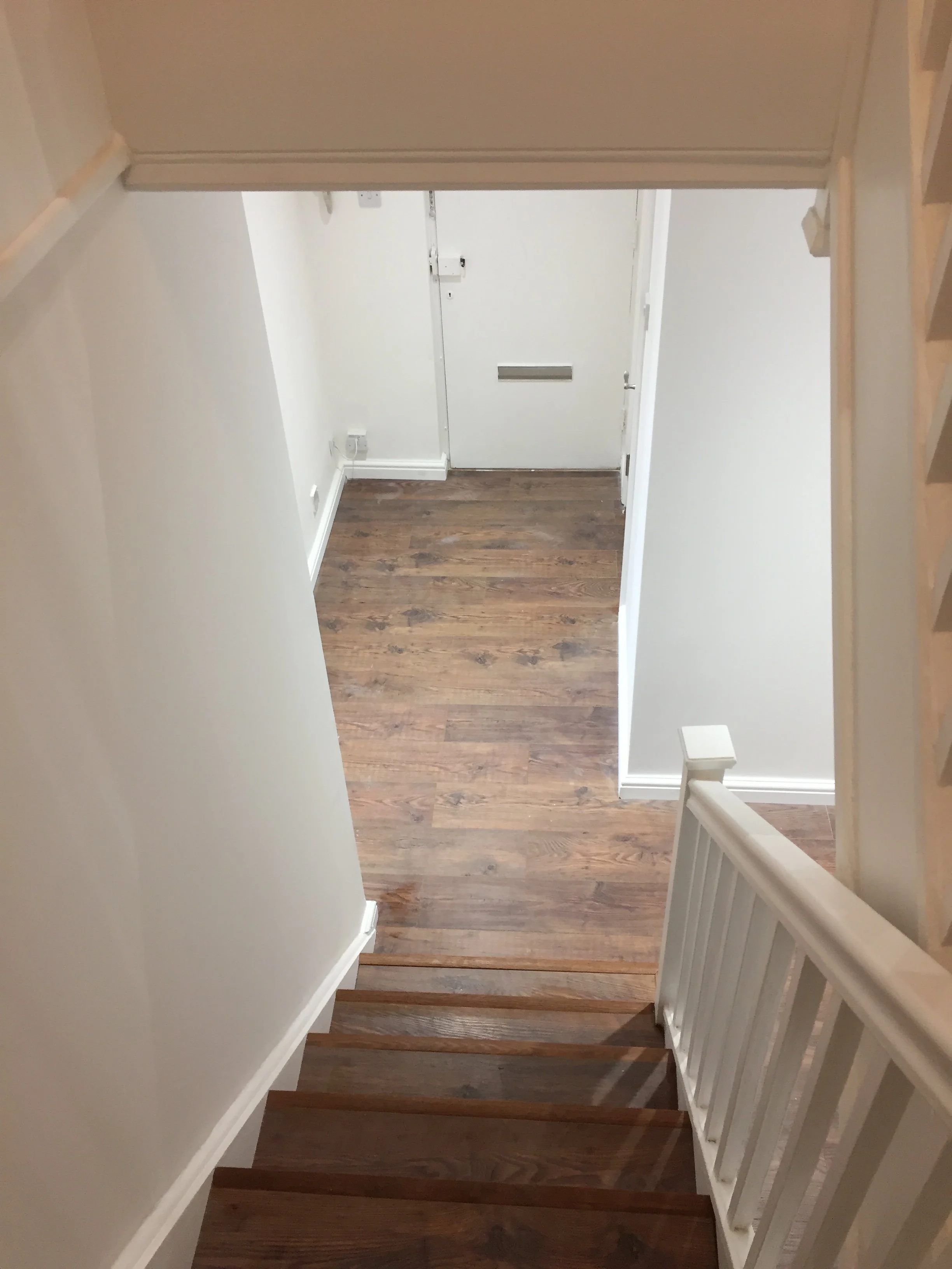 Hardwood flooring installed in refurbished hallway