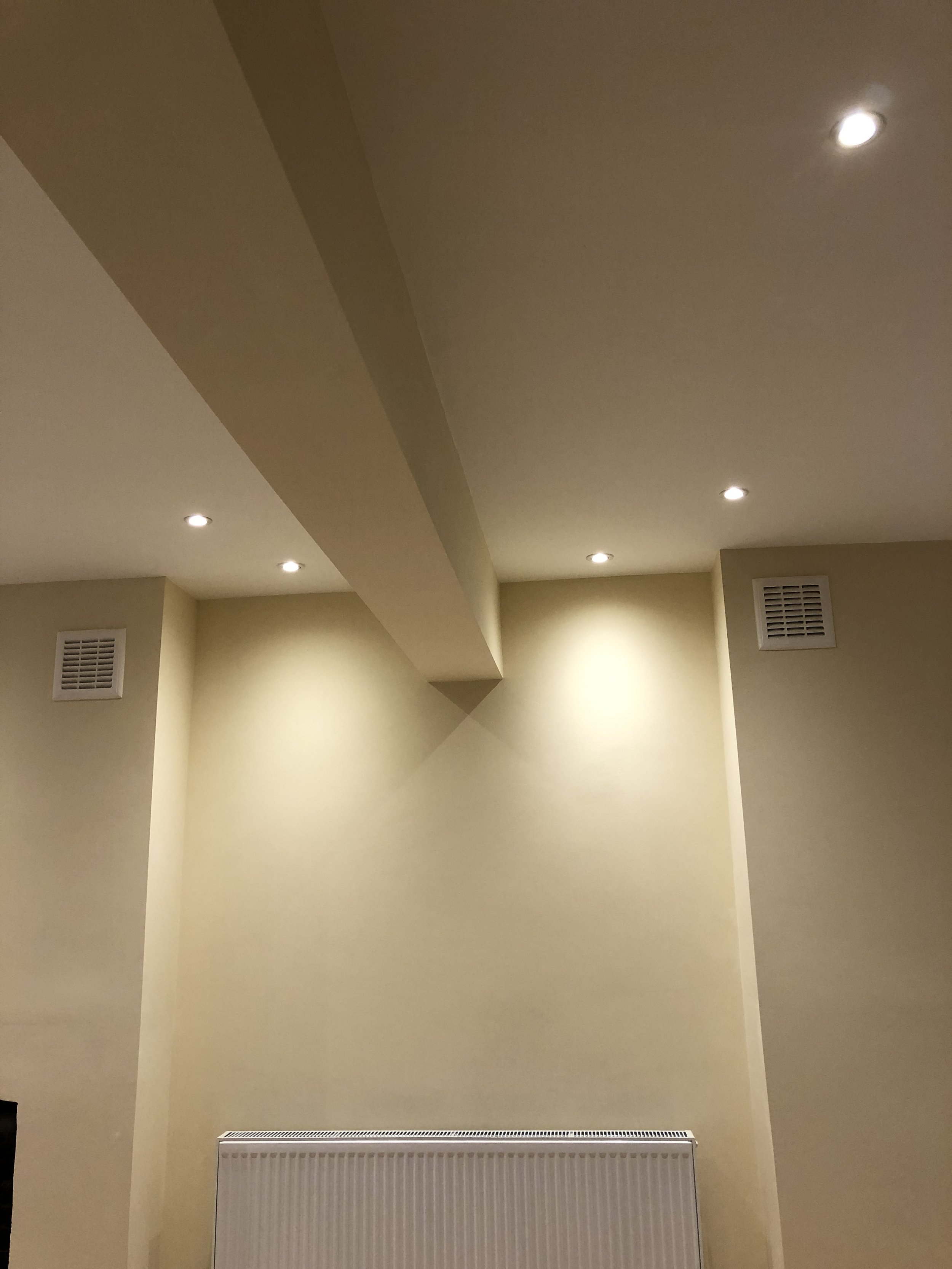 Newly plastered and painted room with spotlights, South London