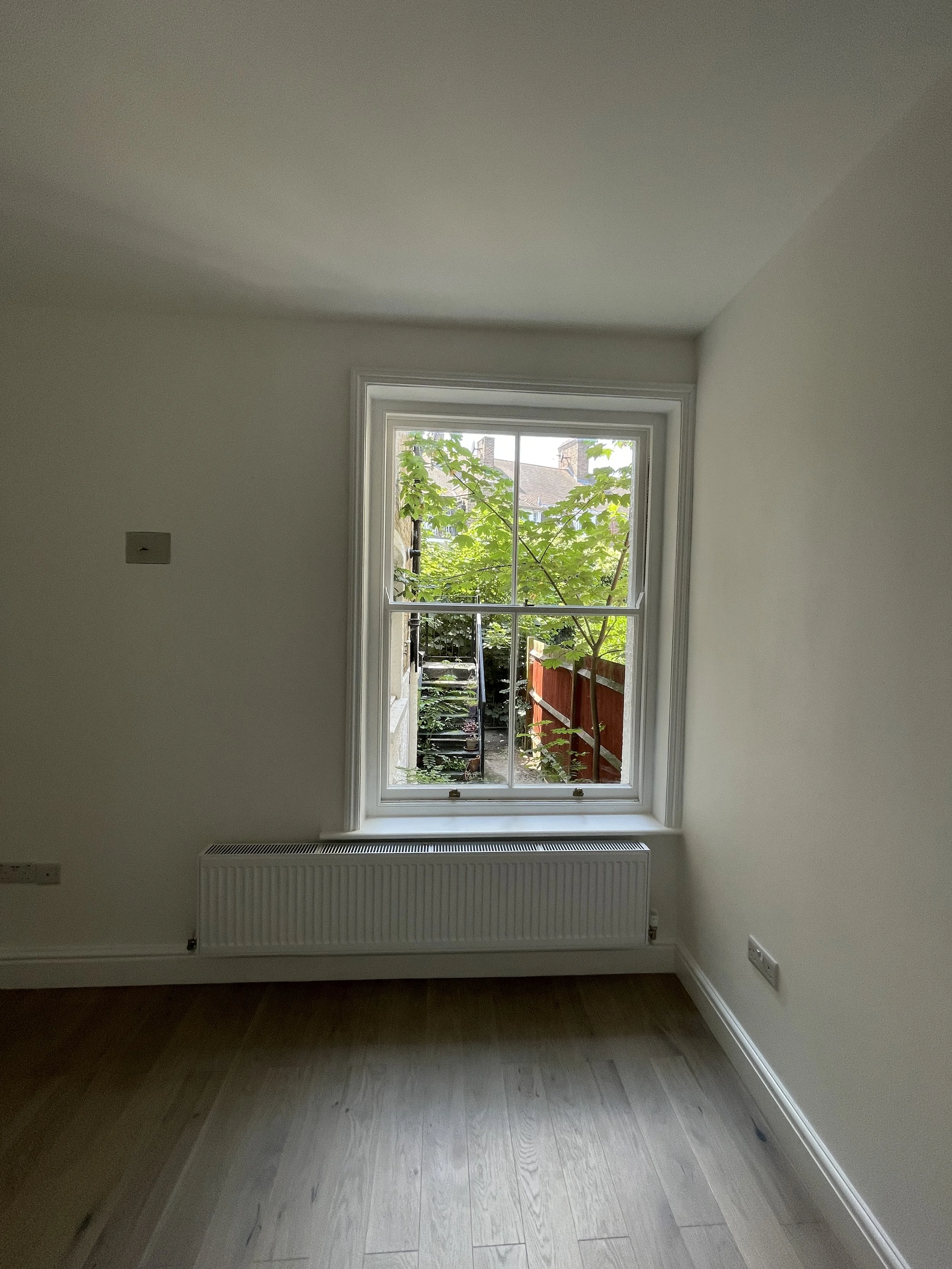 Refurbished and decorated bedroom with window