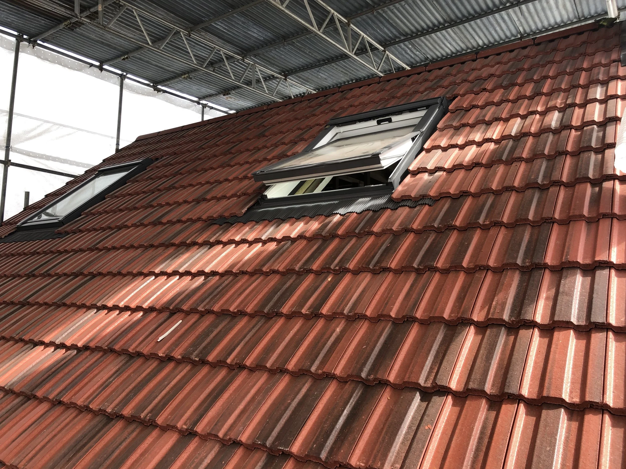Gable roof changed to pitch roof because of Loft Conversion roof carried out with redland tiles 49 in South East London