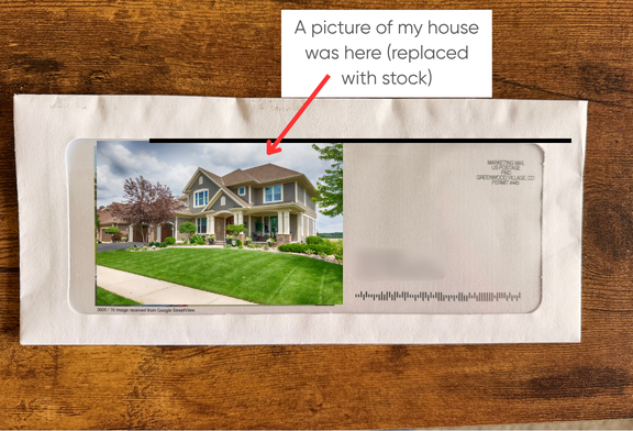 Picture of an envelope with a photo of a house in the envelope's window